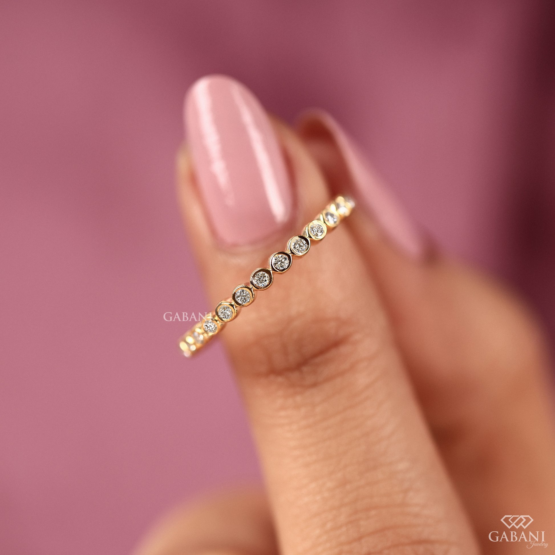 minimal bezel set lab grown diamond eternity band in gold, delicate and thin stacking ring