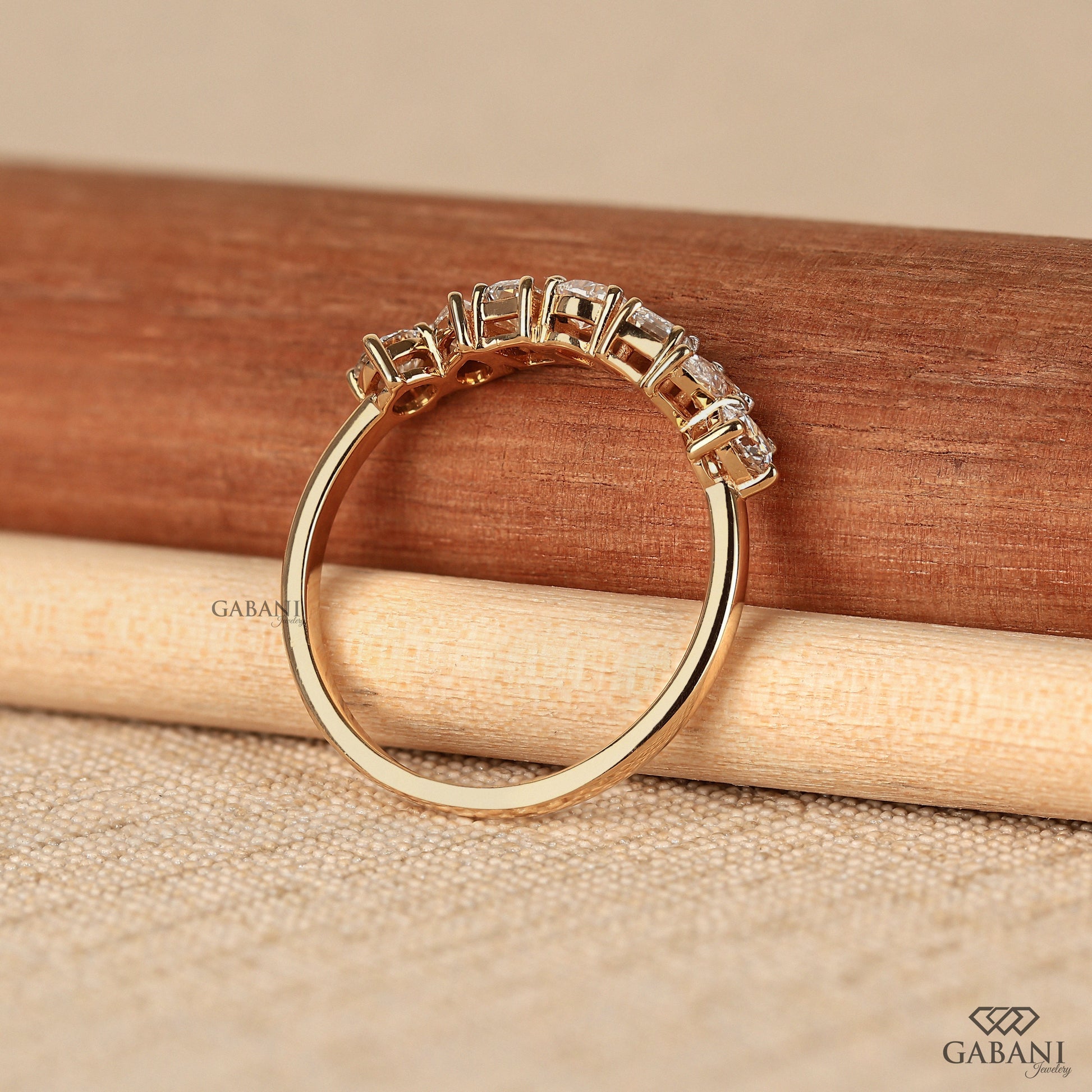 Prong set lab grown diamond wedding band in smooth yellow gold