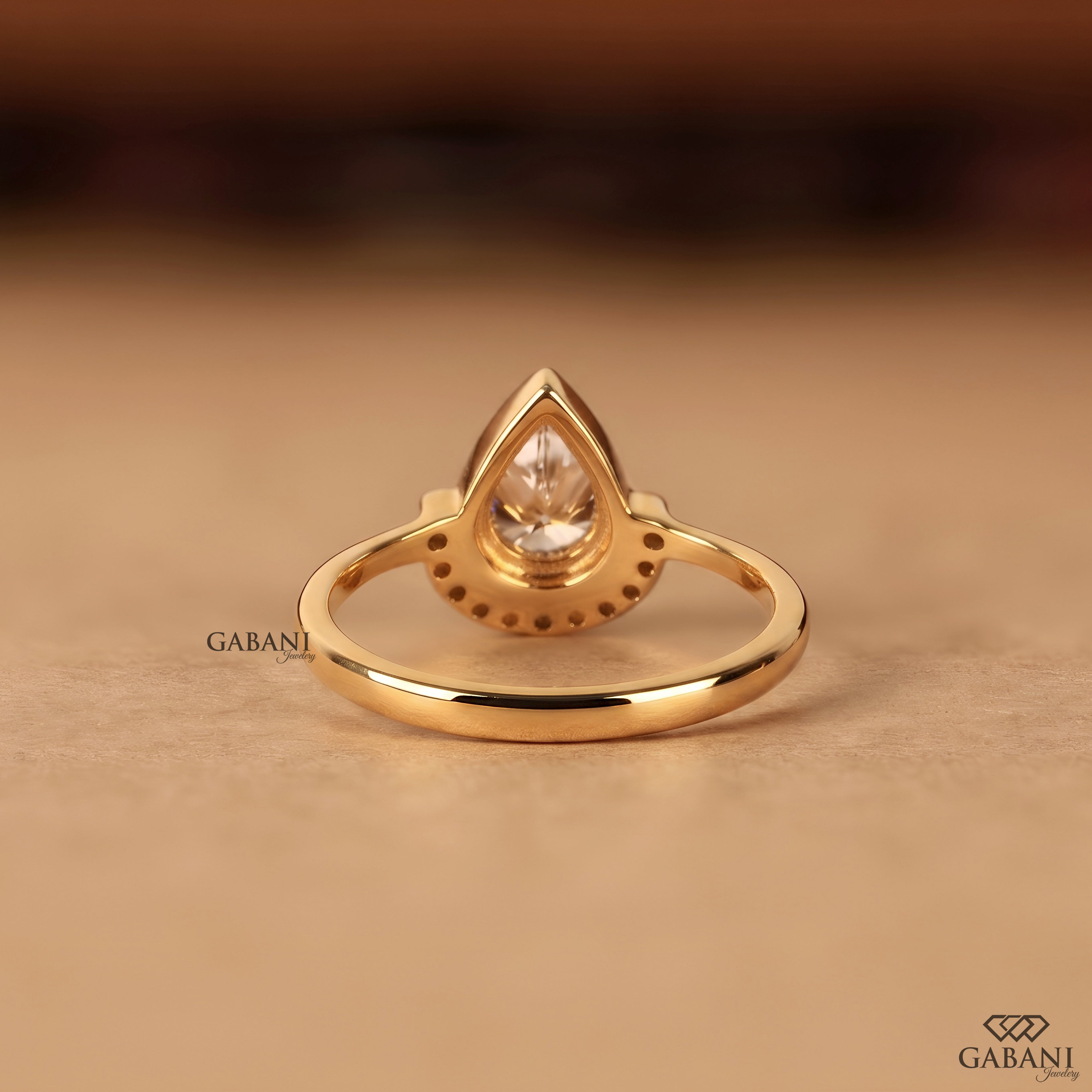 IGI certified lab grown diamond pear cut engagement ring in yellow gold