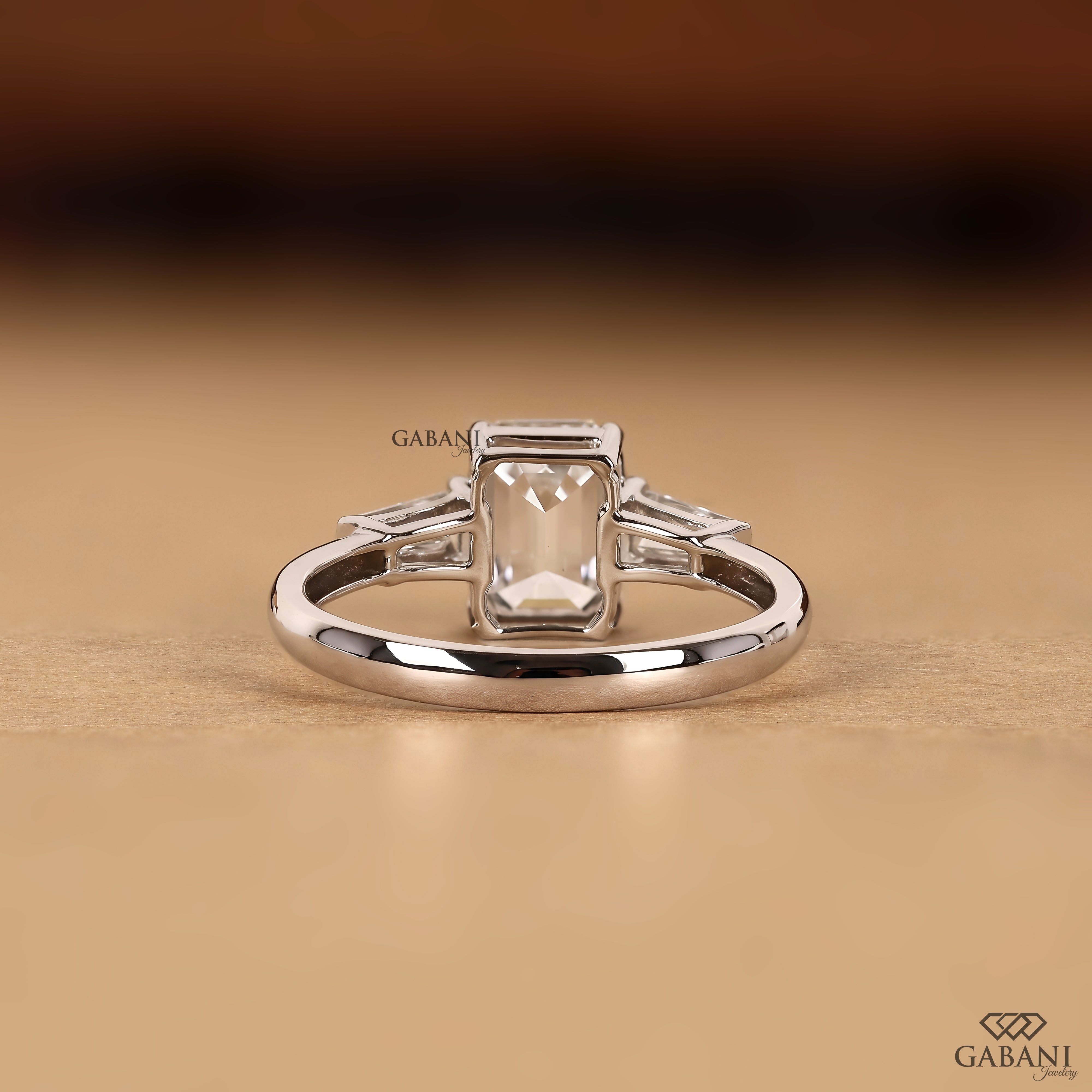 Emerald cut lab grown diamond ring with classic three stone design