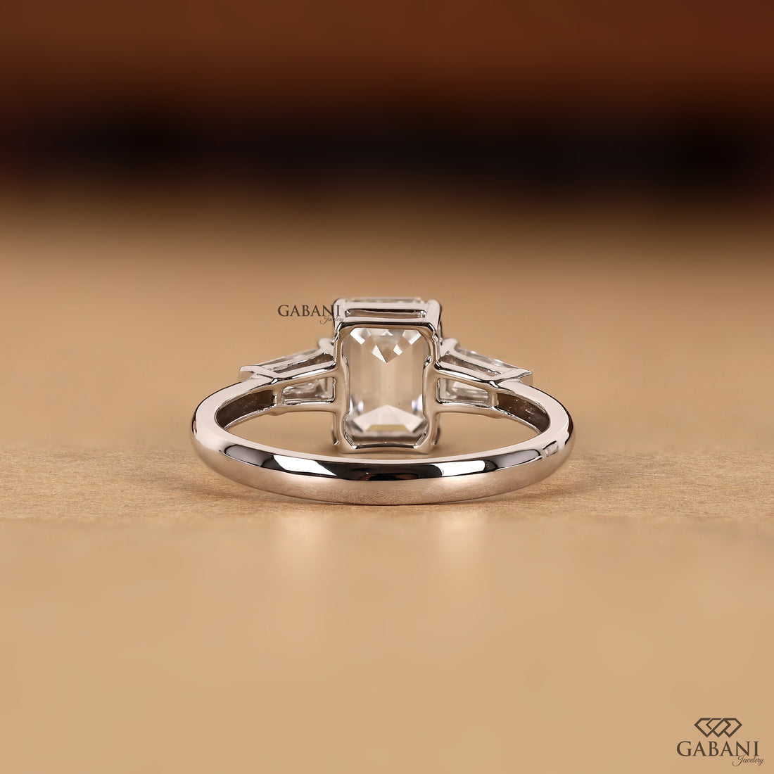 Emerald cut lab grown diamond ring with classic three stone design