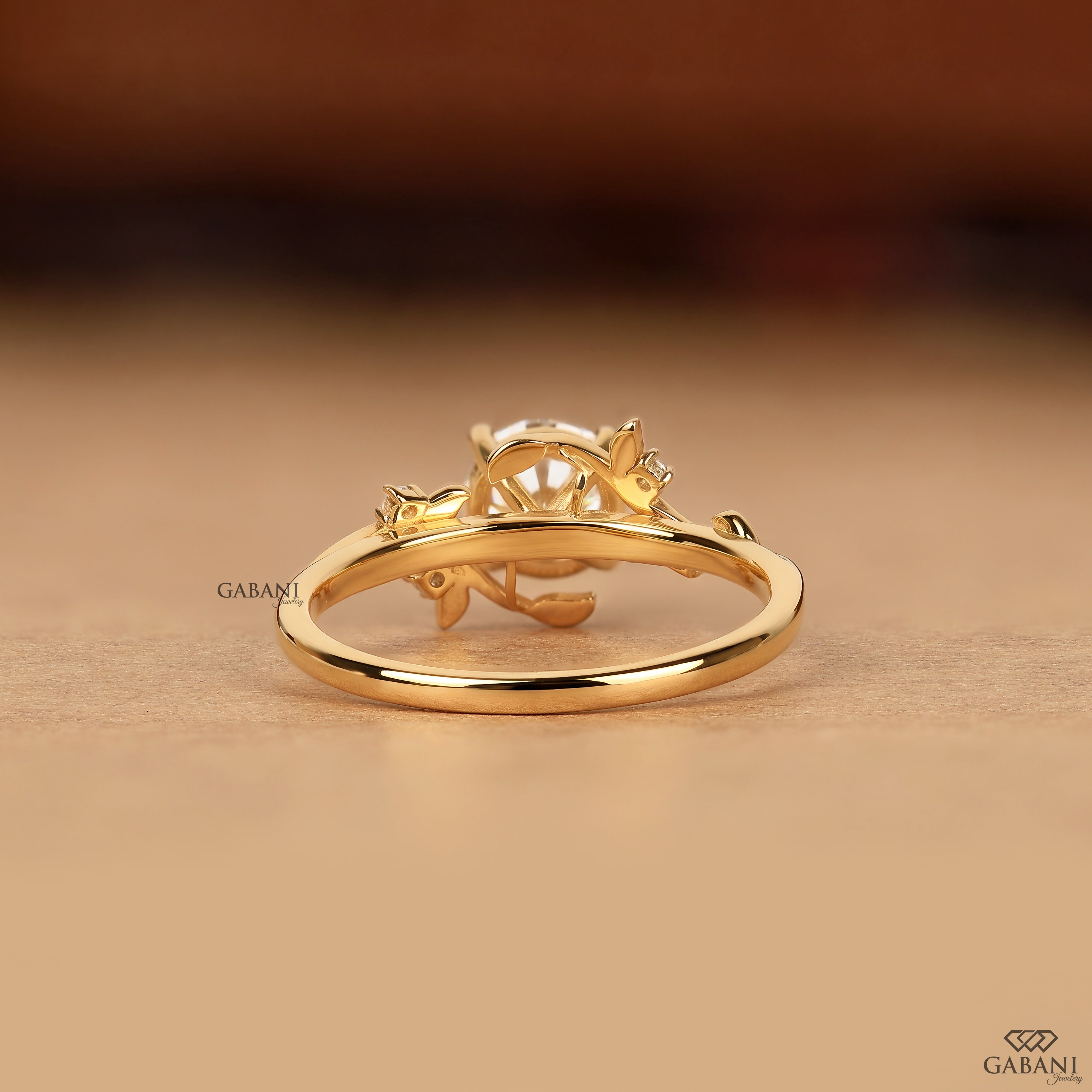 Round diamond vine leaf proposal ring