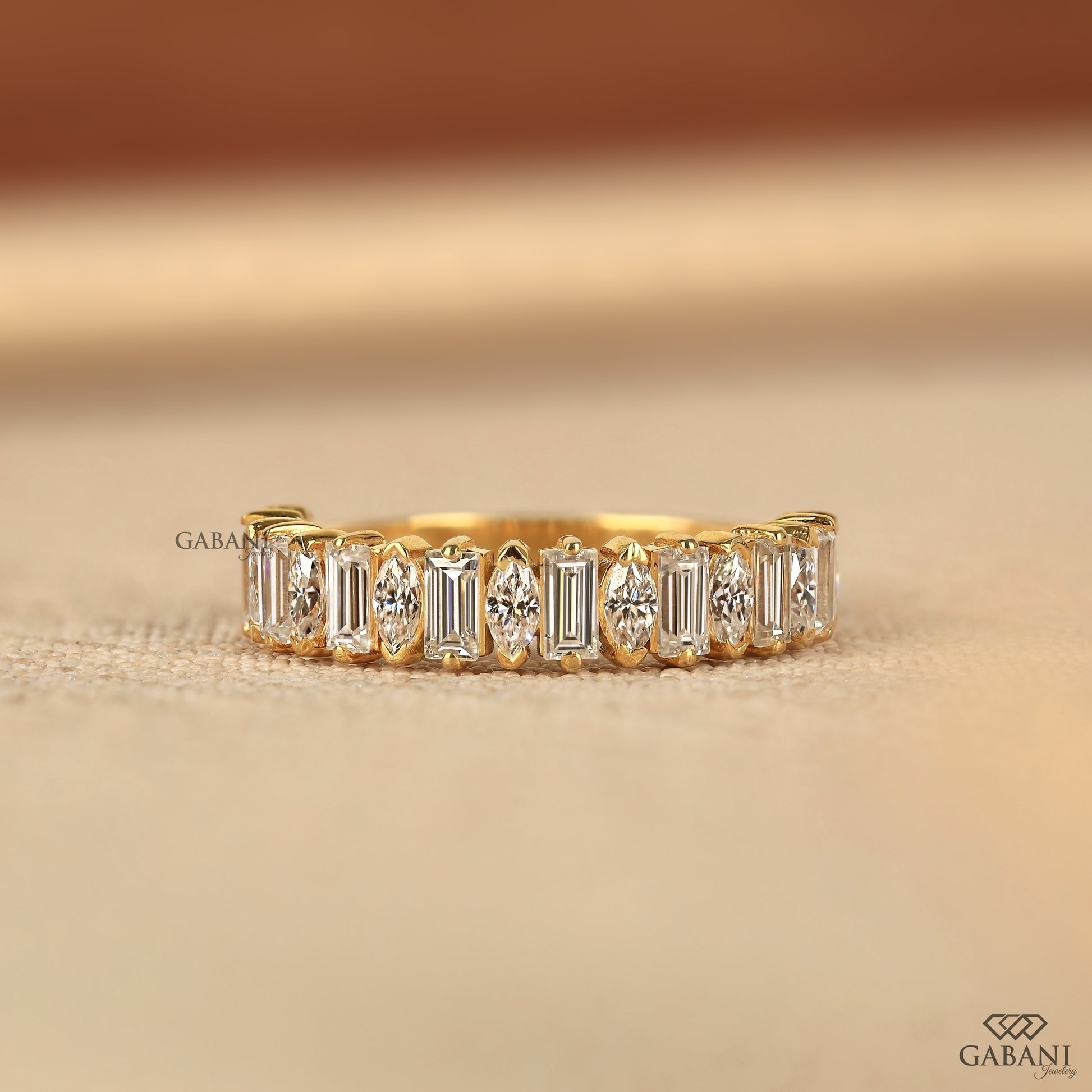 Handmade baguette and marquise lab diamond half eternity ring by Gabani Jewelry