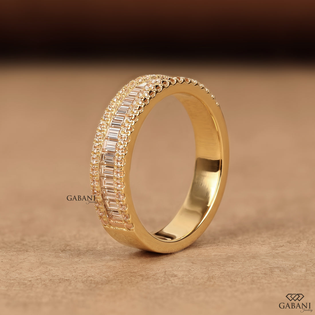 Standing view by model wearing a wide yellow gold lab grown diamond wedding band