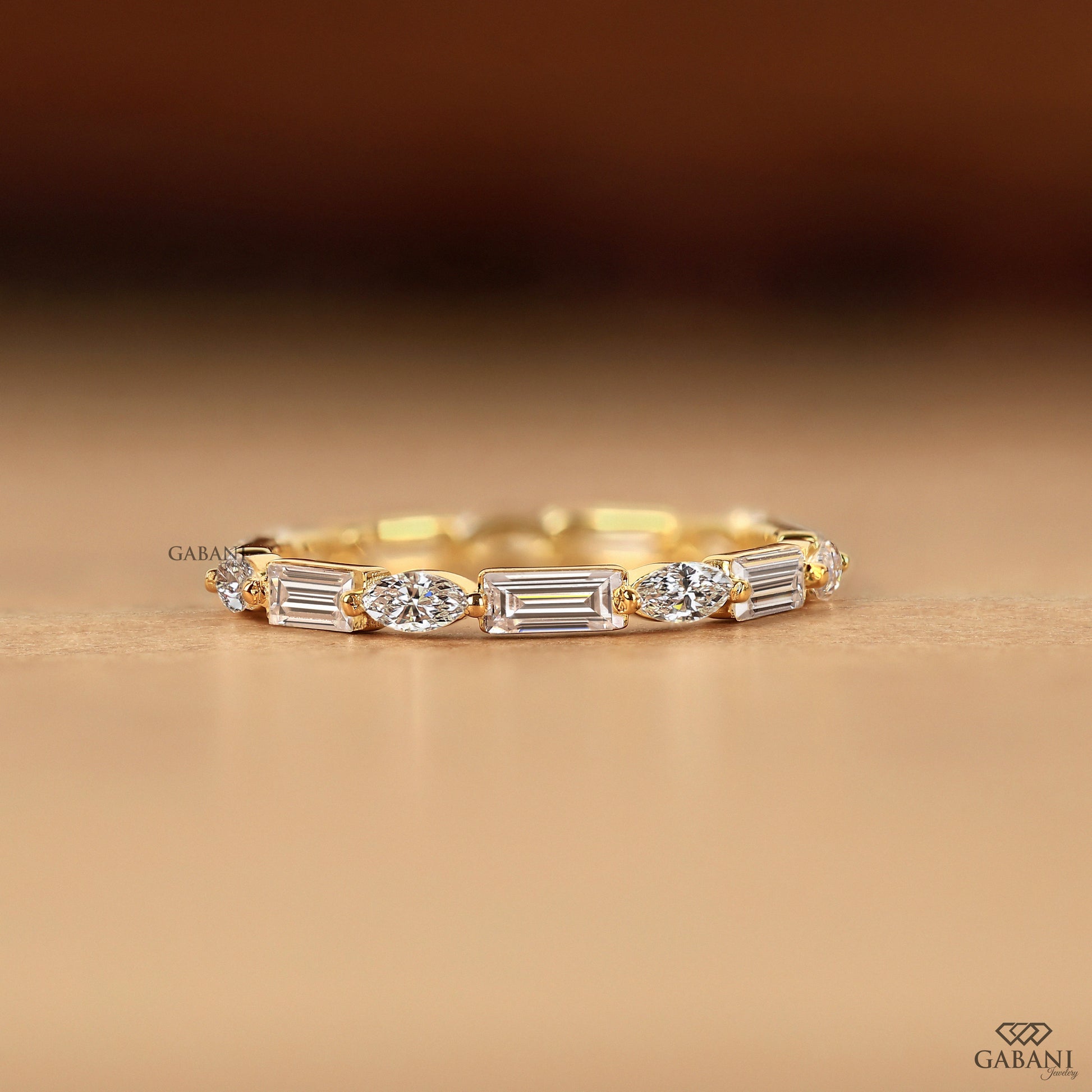 solid gold wedding band with marquise and baguette lab diamonds
