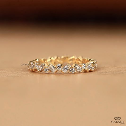 Gabani Jewelry baguette and round lab diamond eternity band in yellow gold