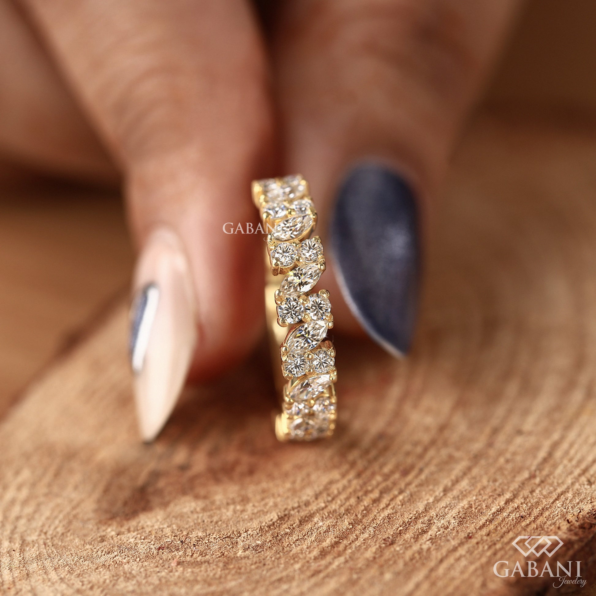 yellow gold half eternity band with alternating marquise and two round lab grown diamonds in prong setting