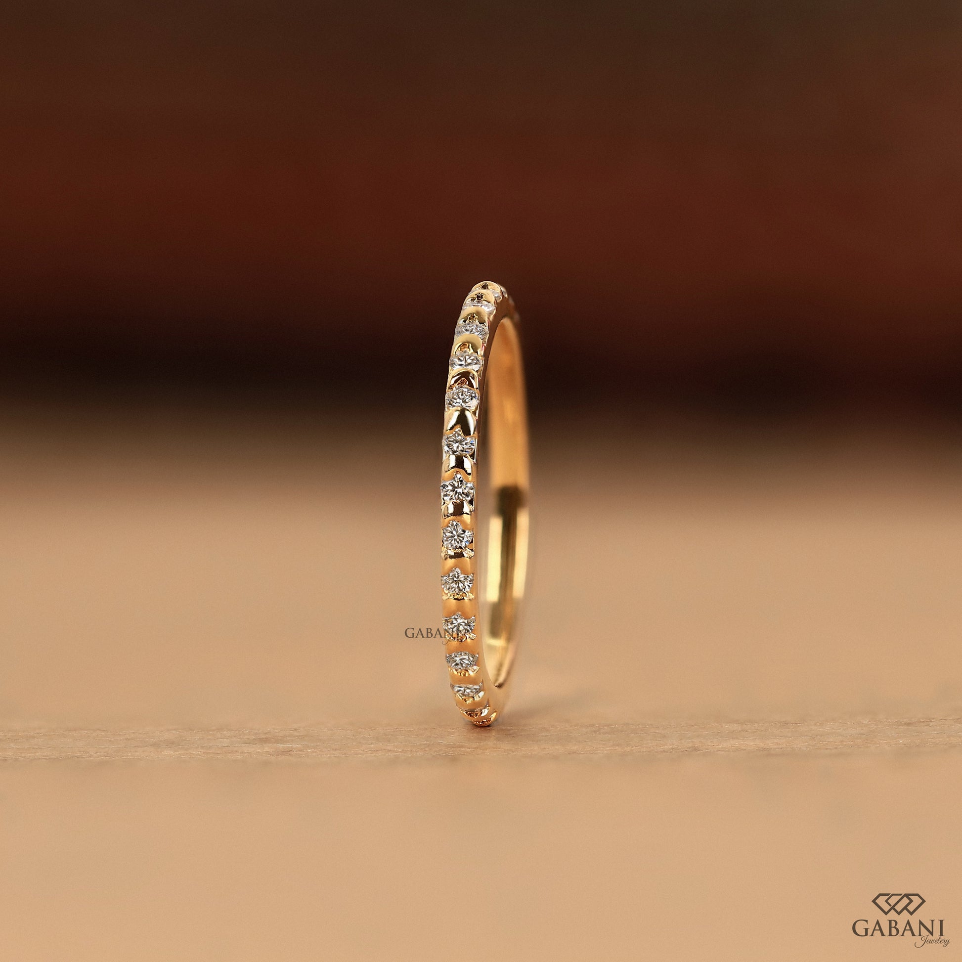 minimal yellow gold wedding band with round lab grown diamonds in slim eternity style