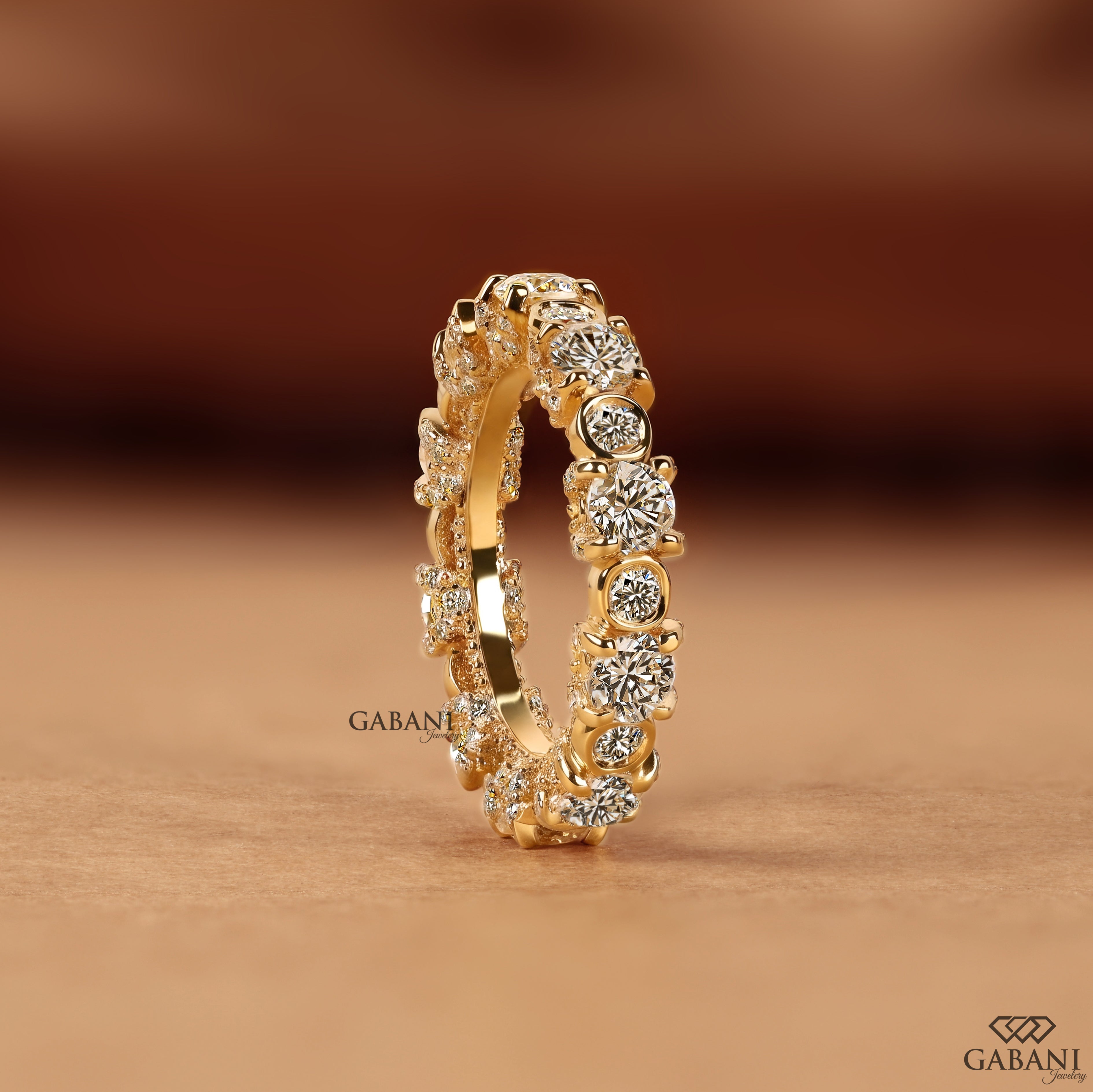 Stacking diamond band with bezel and prong set round diamonds
