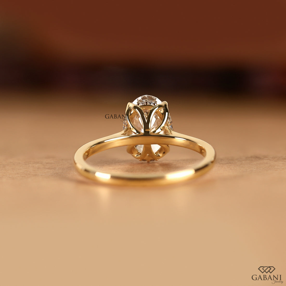 Rear view of the handcrafted oval cut lab grown diamond engagement ring featuring a graceful tulip setting and smooth solitaire band, highlighting the refined craftsmanship and elegant hidden halo design by Gabani Jewelry.