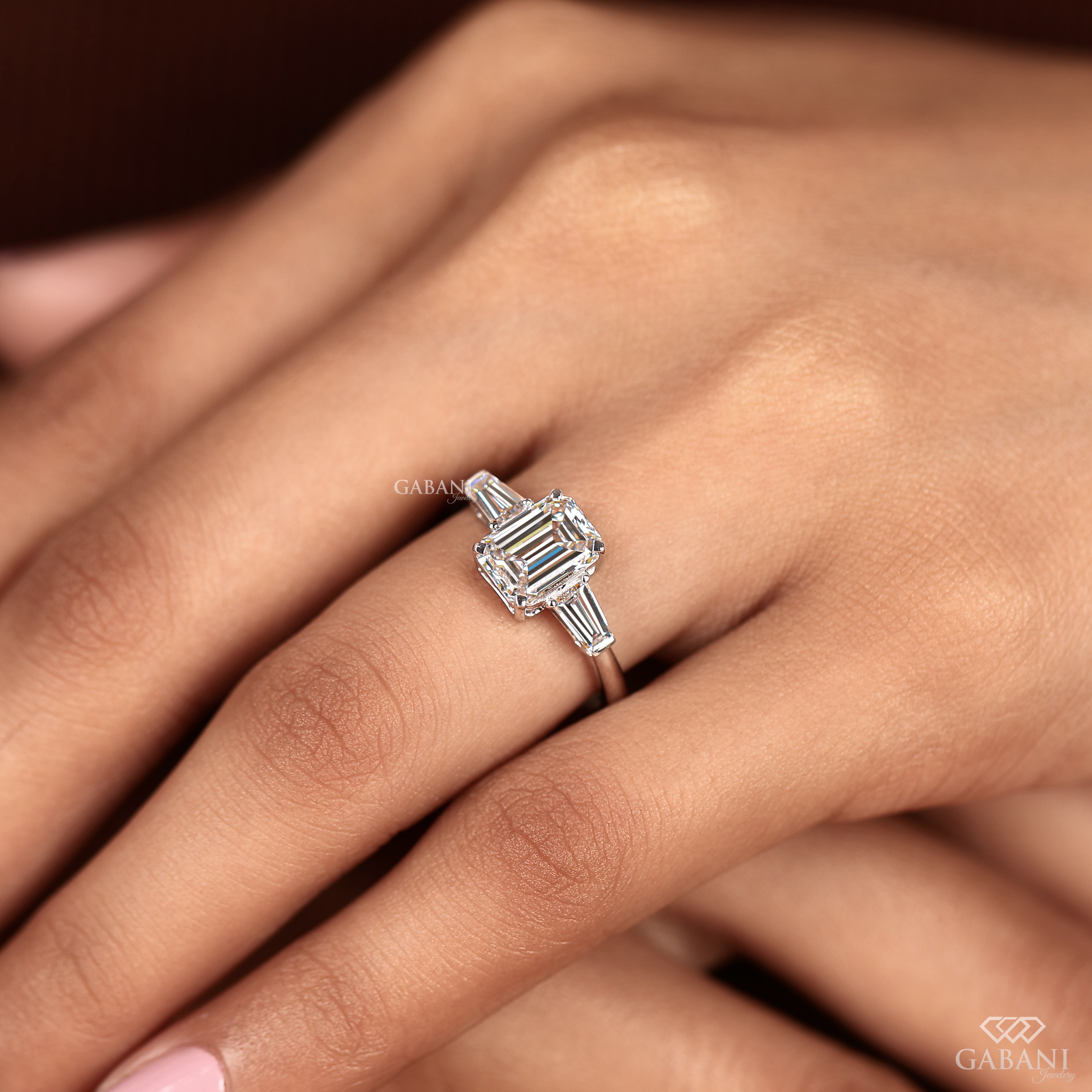 White gold engagement ring with emerald cut lab grown diamond