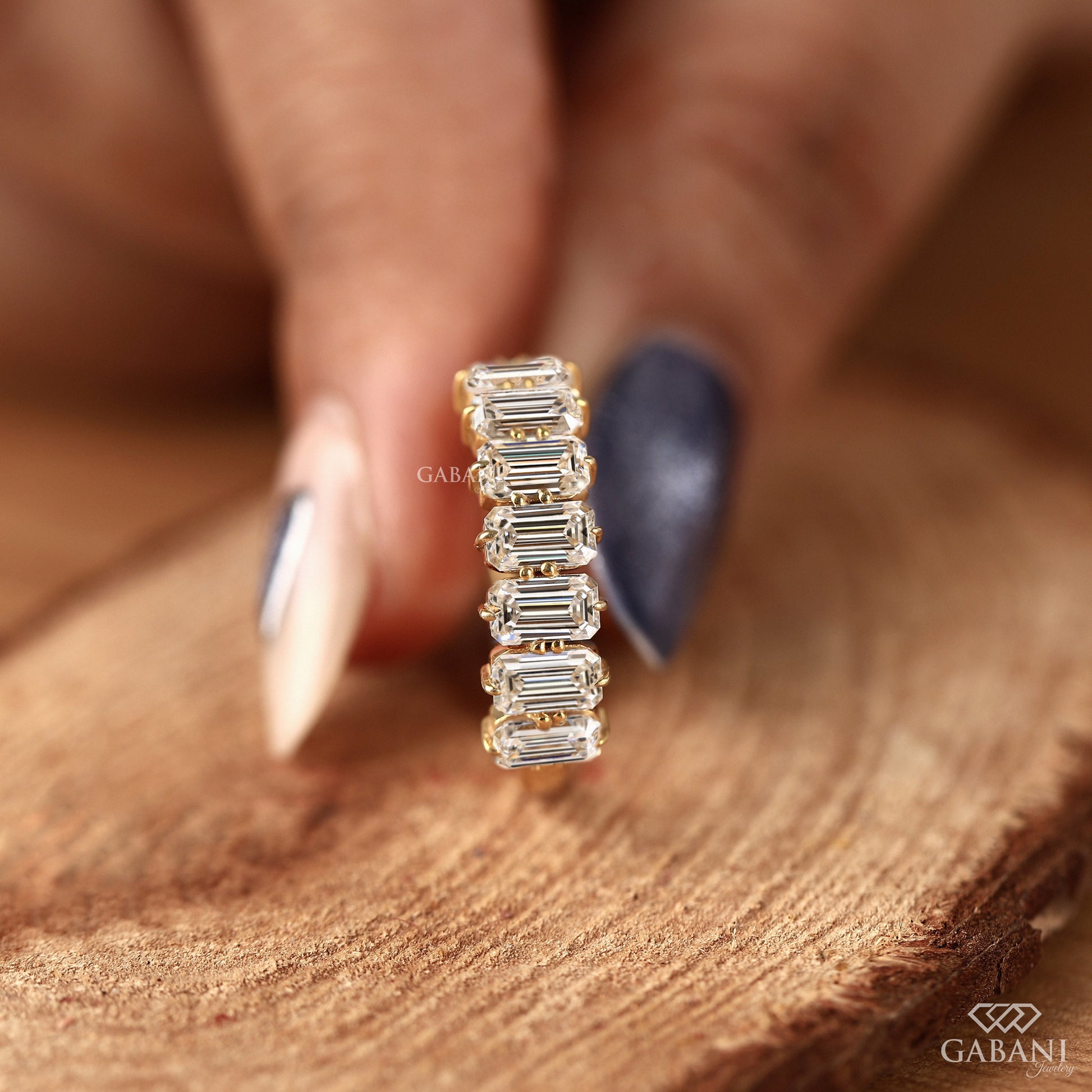 Emerald cut lab grown diamond half eternity ring designed as a matching wedding band in yellow gold