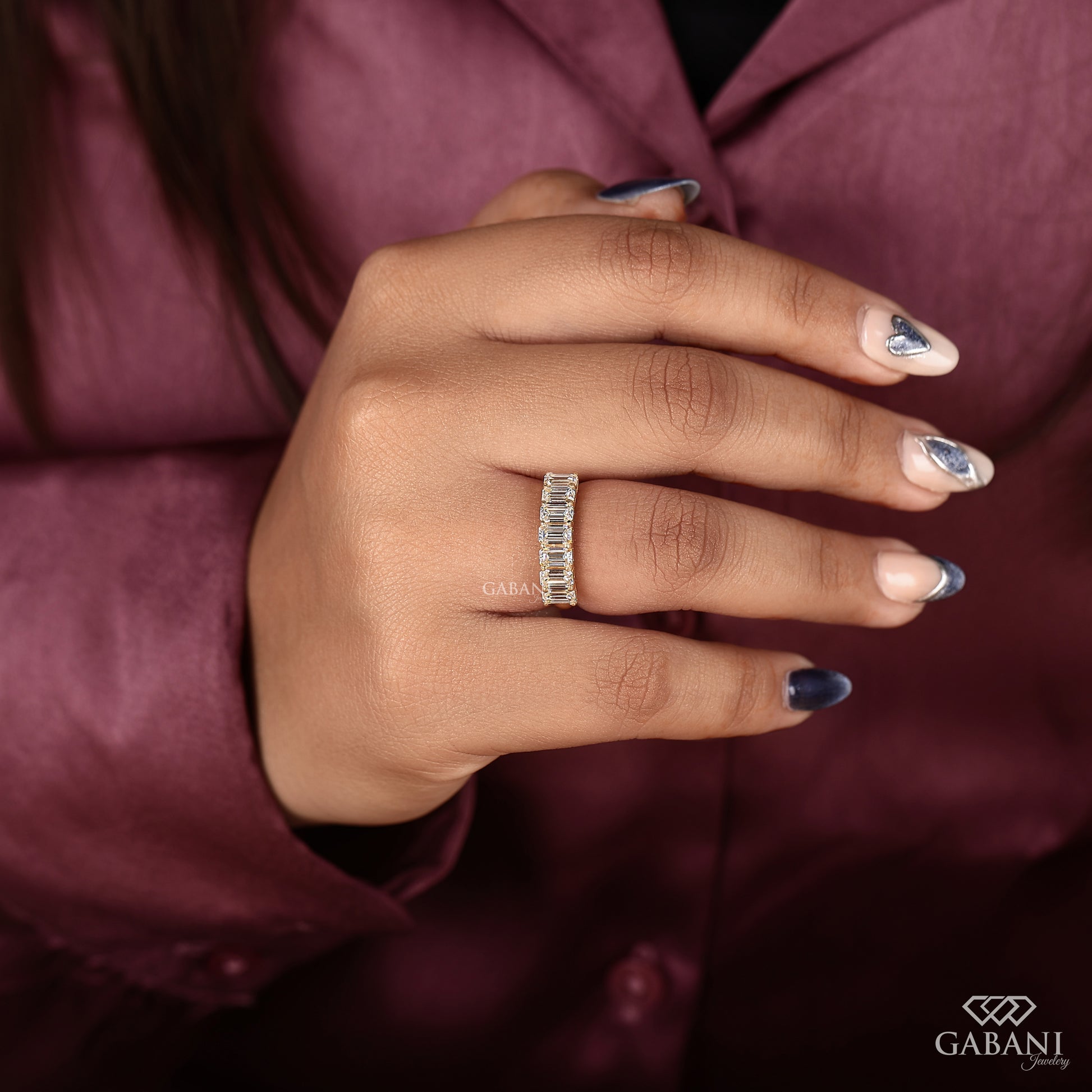 Seven emerald cut lab created diamond band in yellow gold