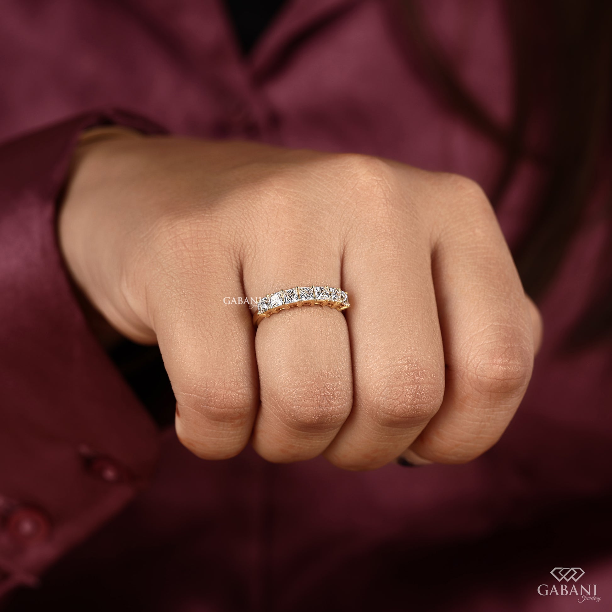 Seven stone lab grown diamond wedding band with princess cut stones
