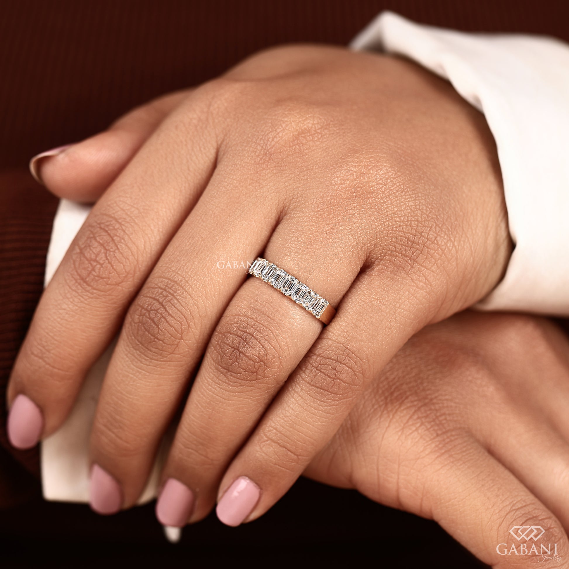 9 stone emerald cut diamond band in yellow gold with clean modern half eternity style
