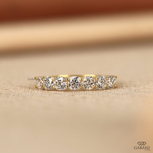 7 cushion cut lab created diamond band in a slim yellow gold design with a clean u prong setting