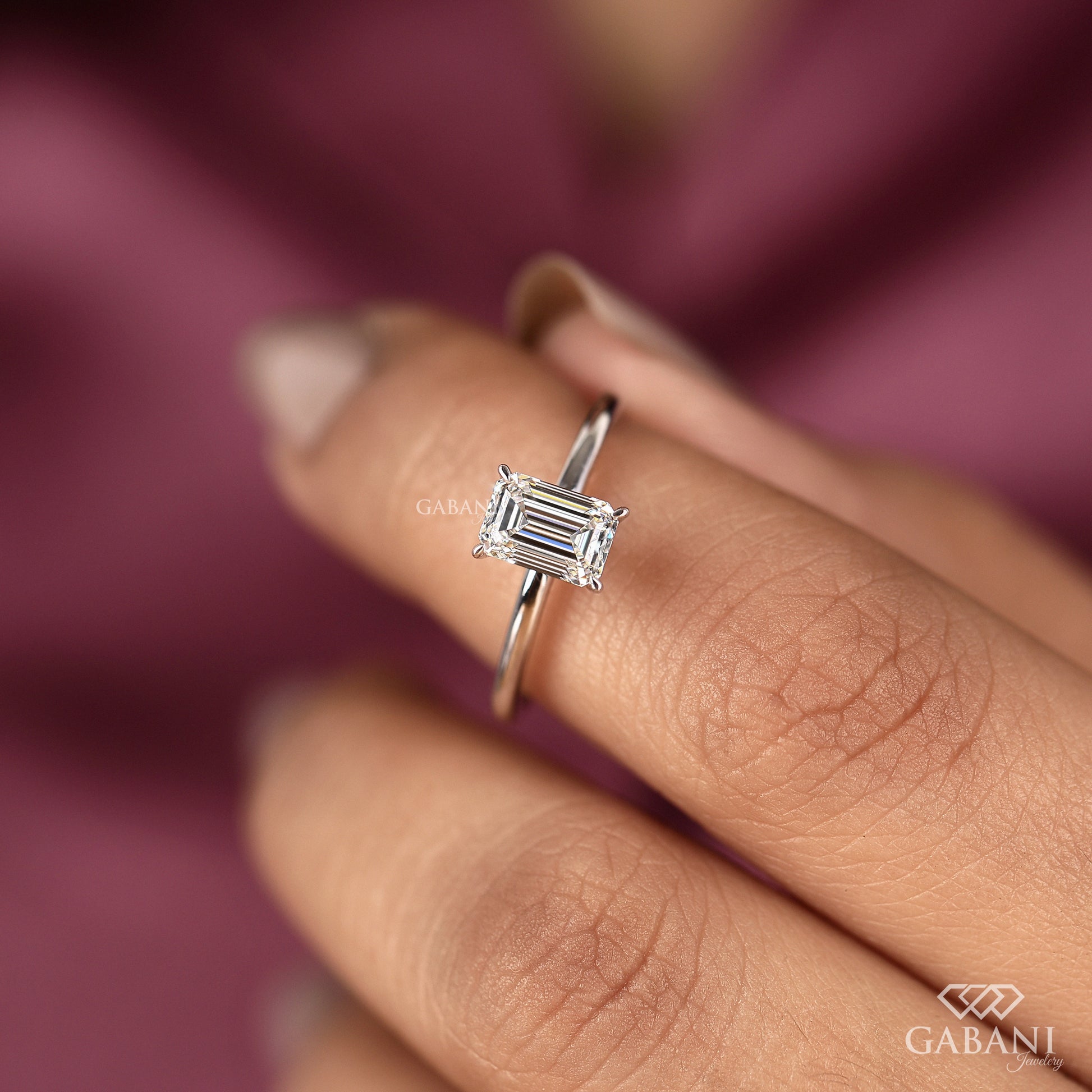 emerald cut lab grown diamond engagement ring with low profile prong setting