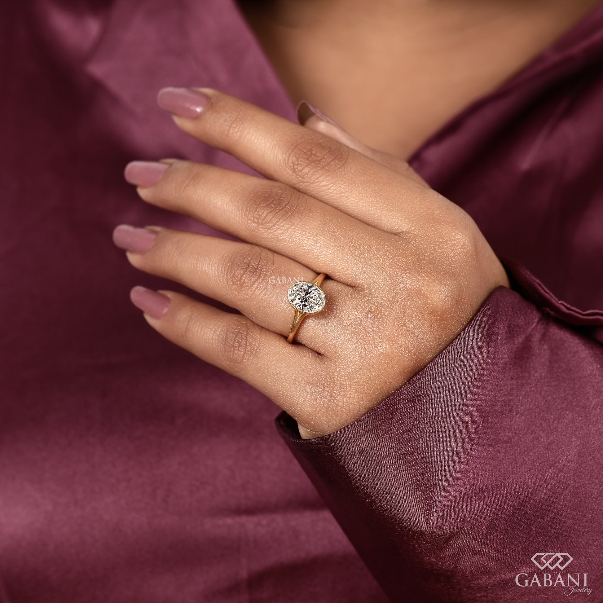 Modern oval cut lab grown diamond ring with slim gold band