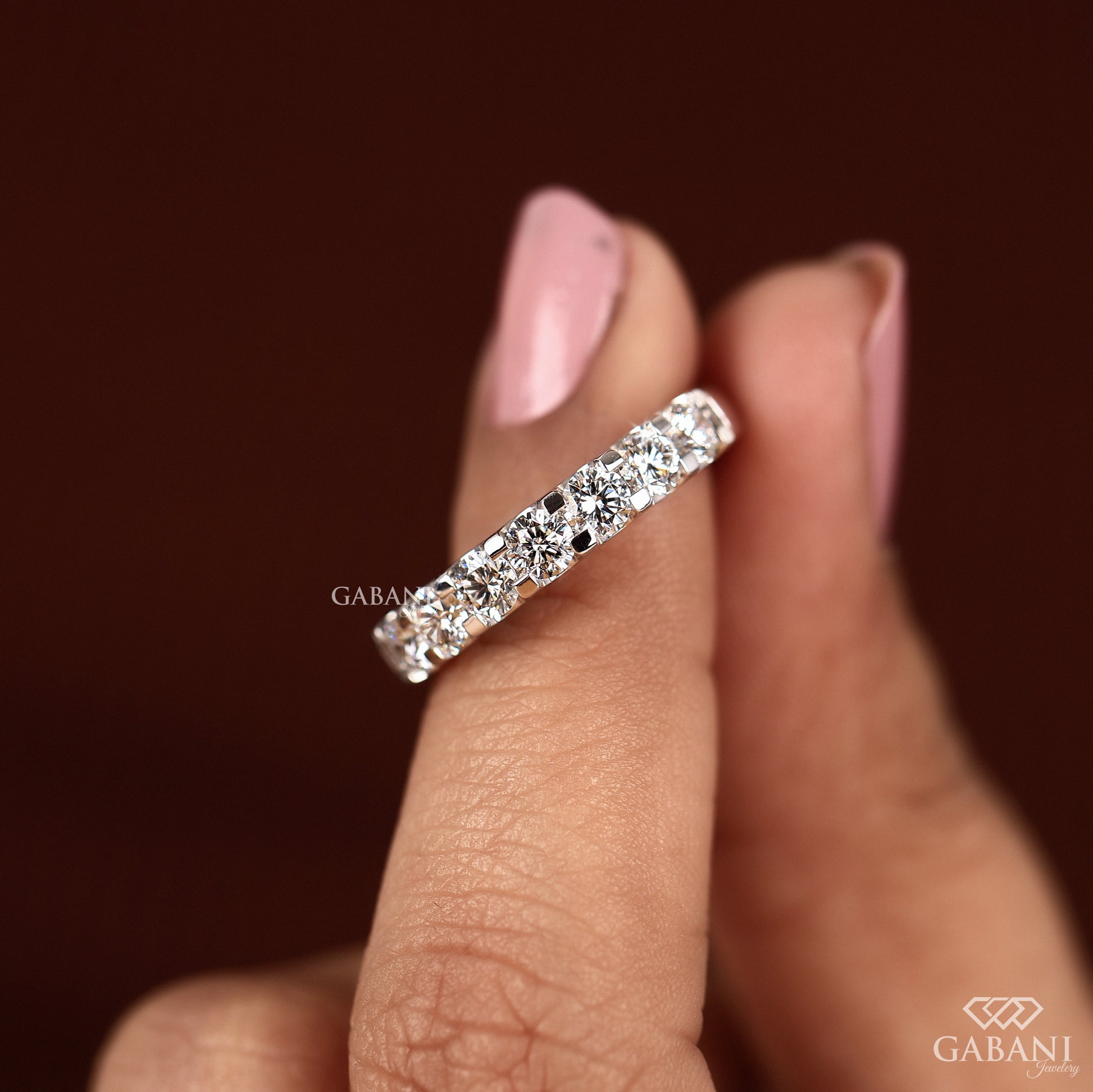 seven stone round lab grown diamond band in shiny white gold French pavé wedding band