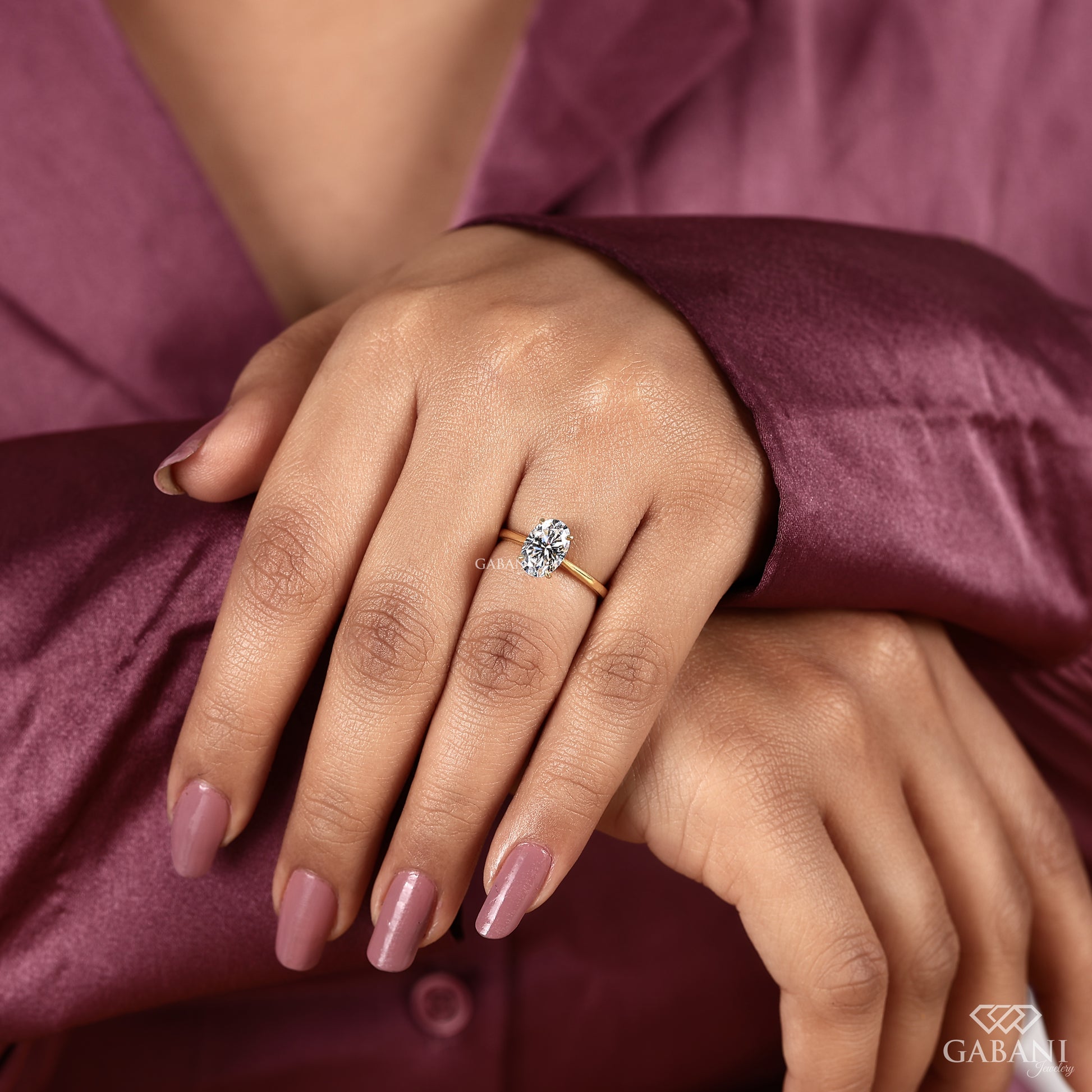 oval cut lab grown diamond ring featuring a clean solitaire setting and subtle polished appearance