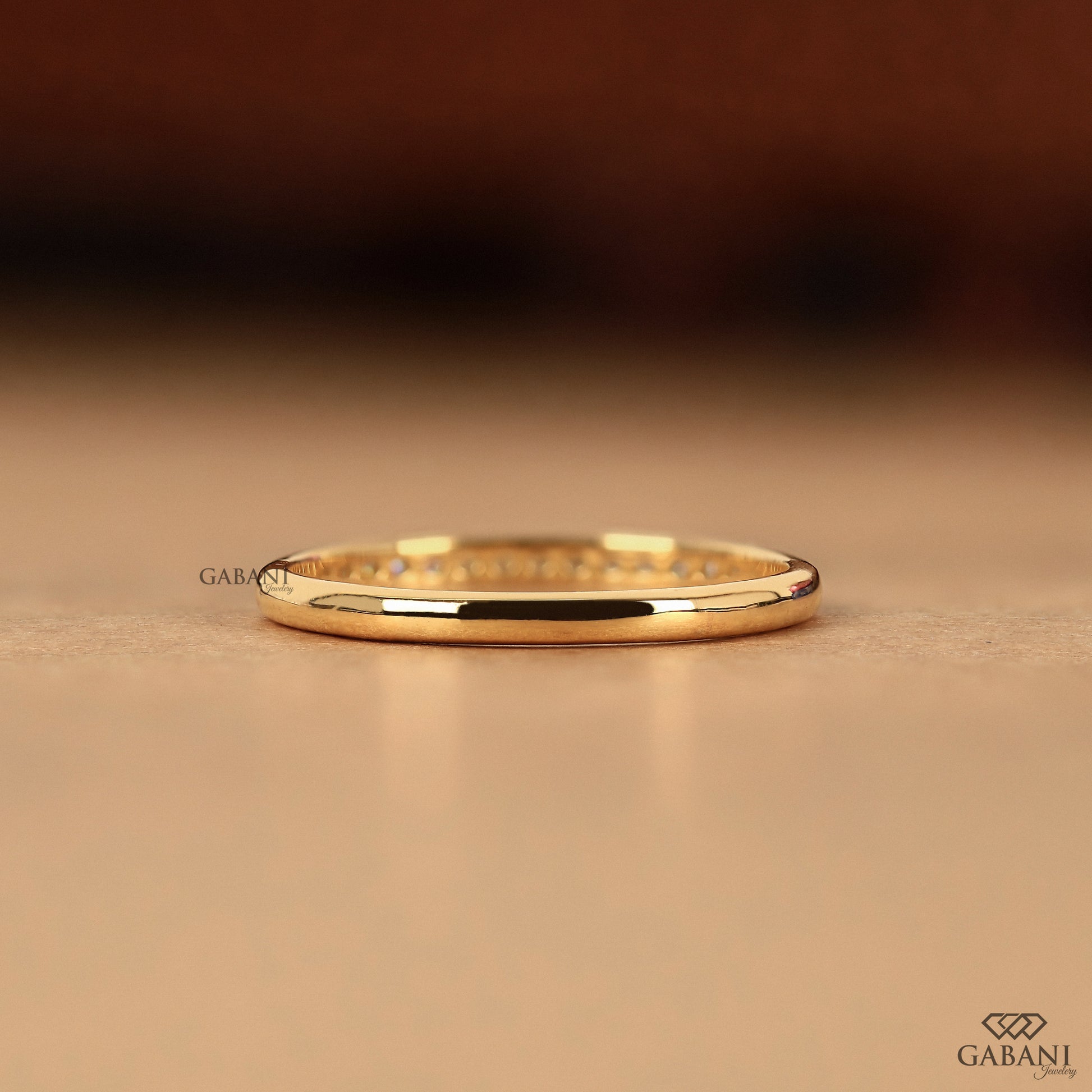minimal diamond stacking band in 14k gold with flush set stones