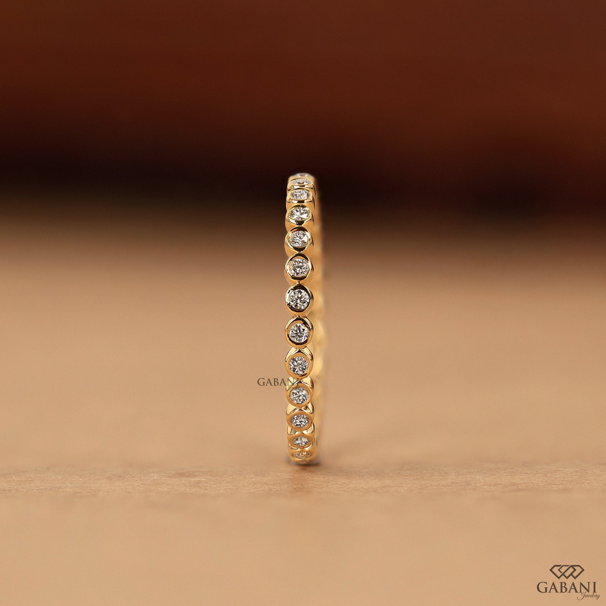 minimal lab grown diamond bezel set wedding band in gold, thin comfort fit eternity band