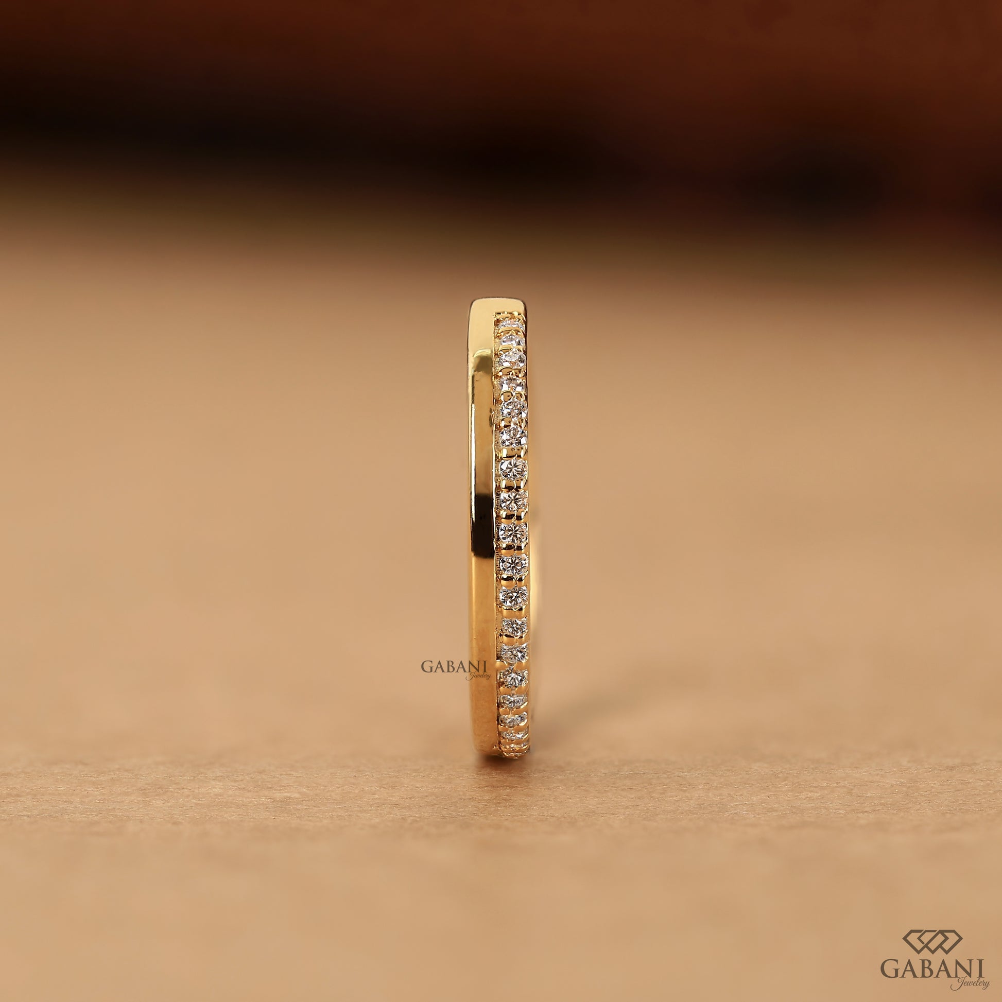 flat gold band with pave set lab grown diamonds half eternity style