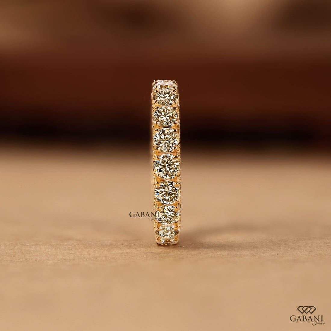 Round cut lab grown diamond full eternity band in yellow gold with continuous diamonds and side accent stones, designed for wedding, anniversary, bridal, and stackable wear.