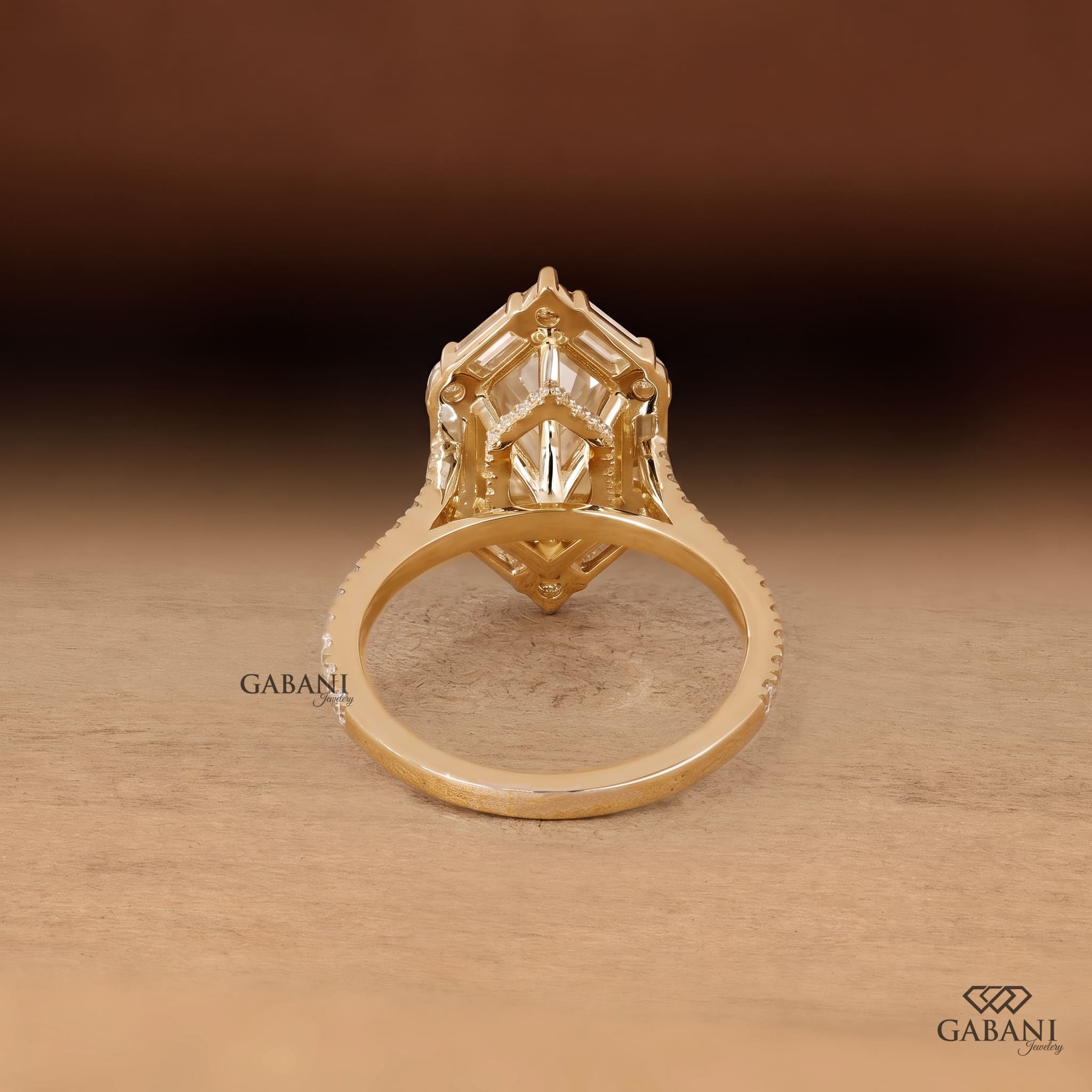 Marquise cut lab grown diamond engagement ring with baguette and round diamond accents, pavé band and yellow gold setting.