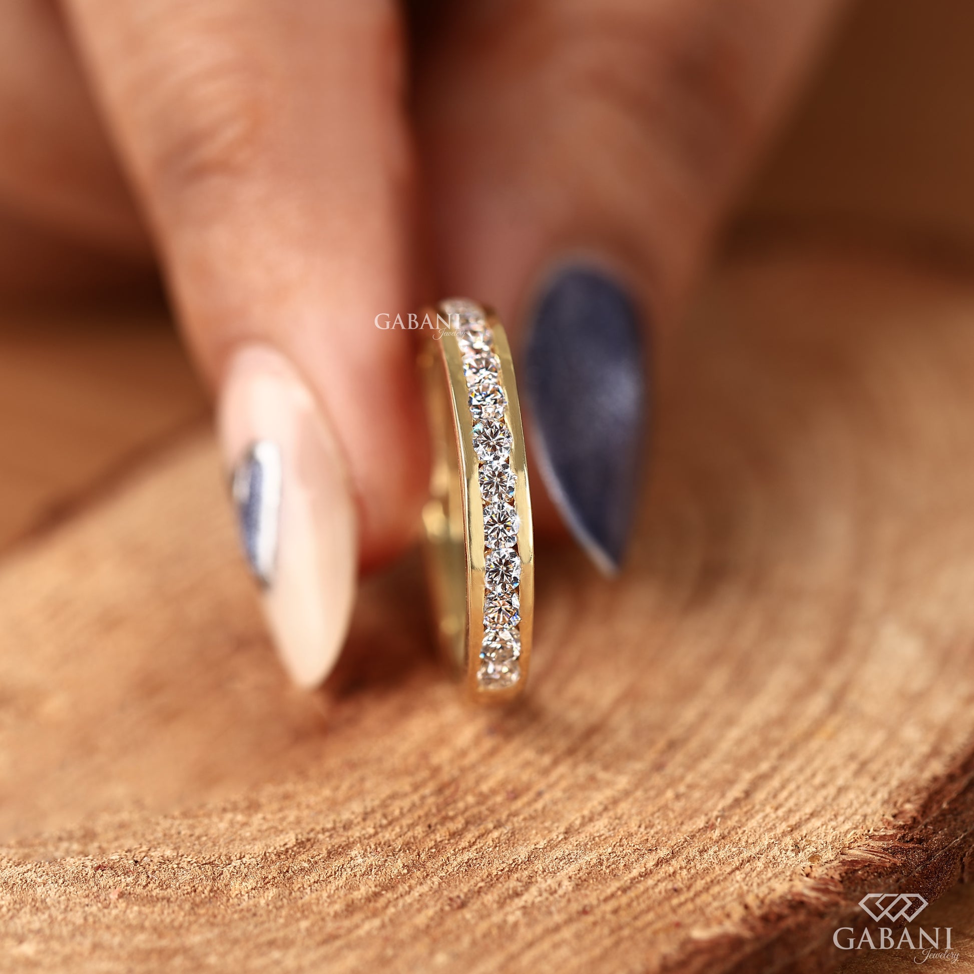 yellow gold channel set band with round lab grown diamonds for daily wear