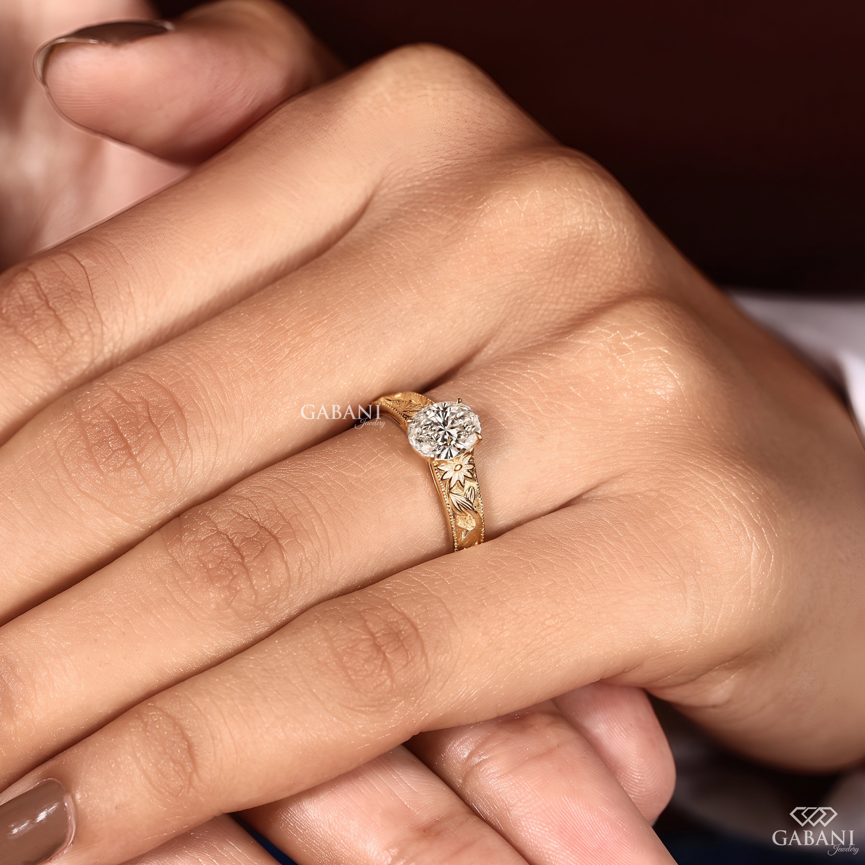 Oval lab created diamond engagement ring with a botanical engraved design