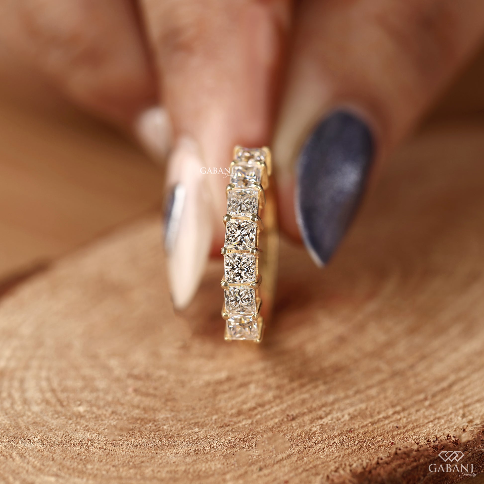Half eternity diamond band with princess cut lab grown diamonds in yellow gold
