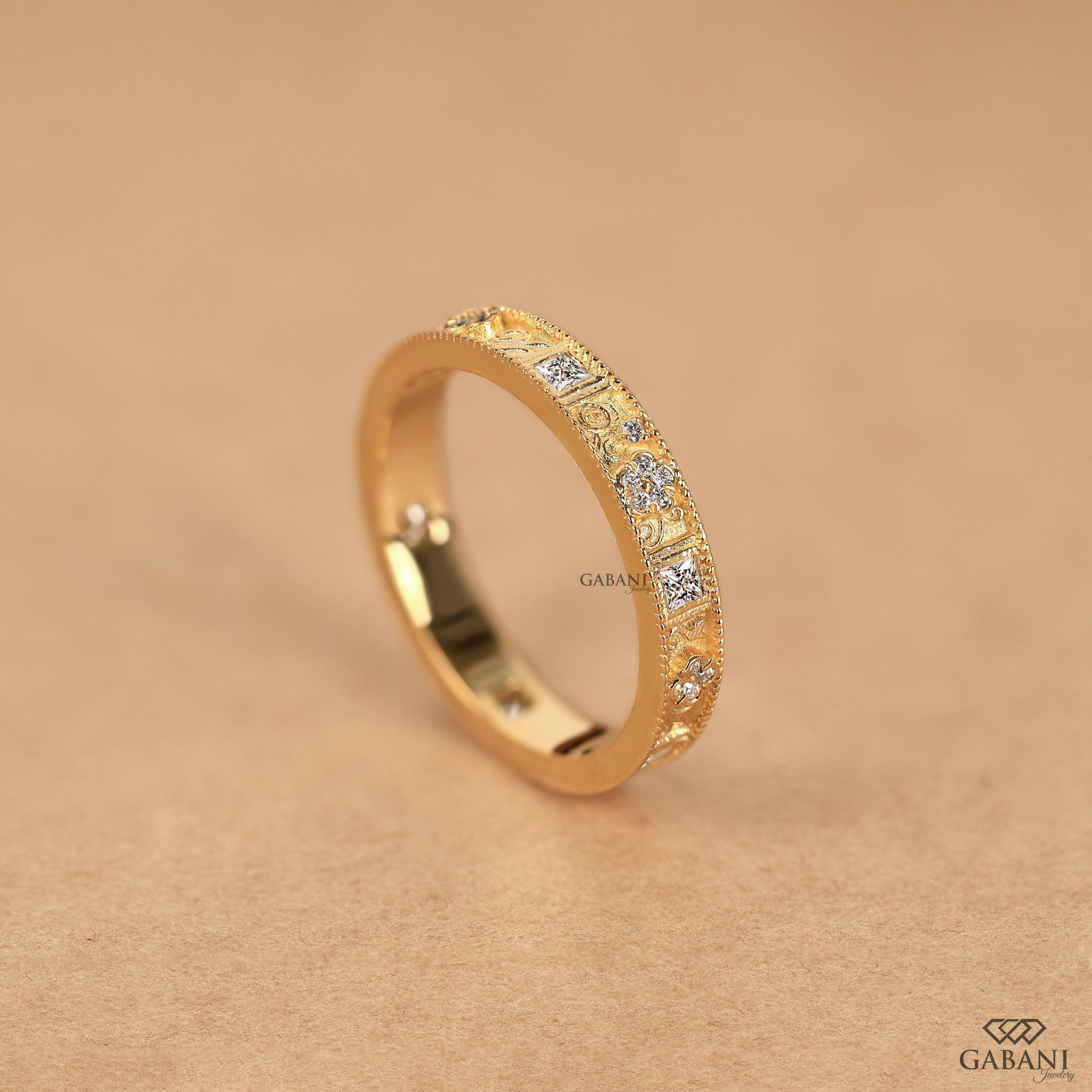 vintage milgrain wedding band with floral engraving and mixed cut lab grown diamonds in 14k yellow gold