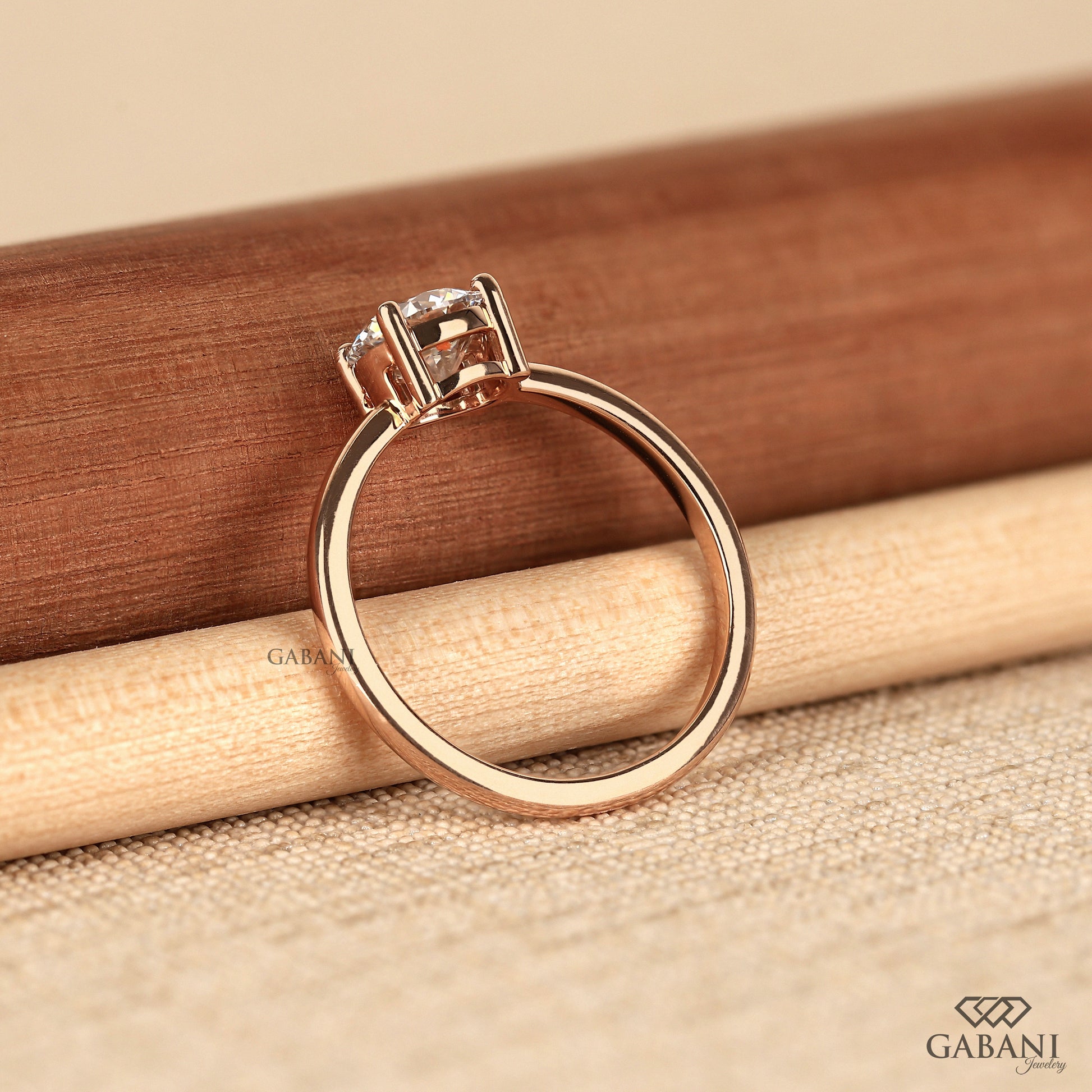 round lab grown diamond solitaire ring with polished 14k rose gold band