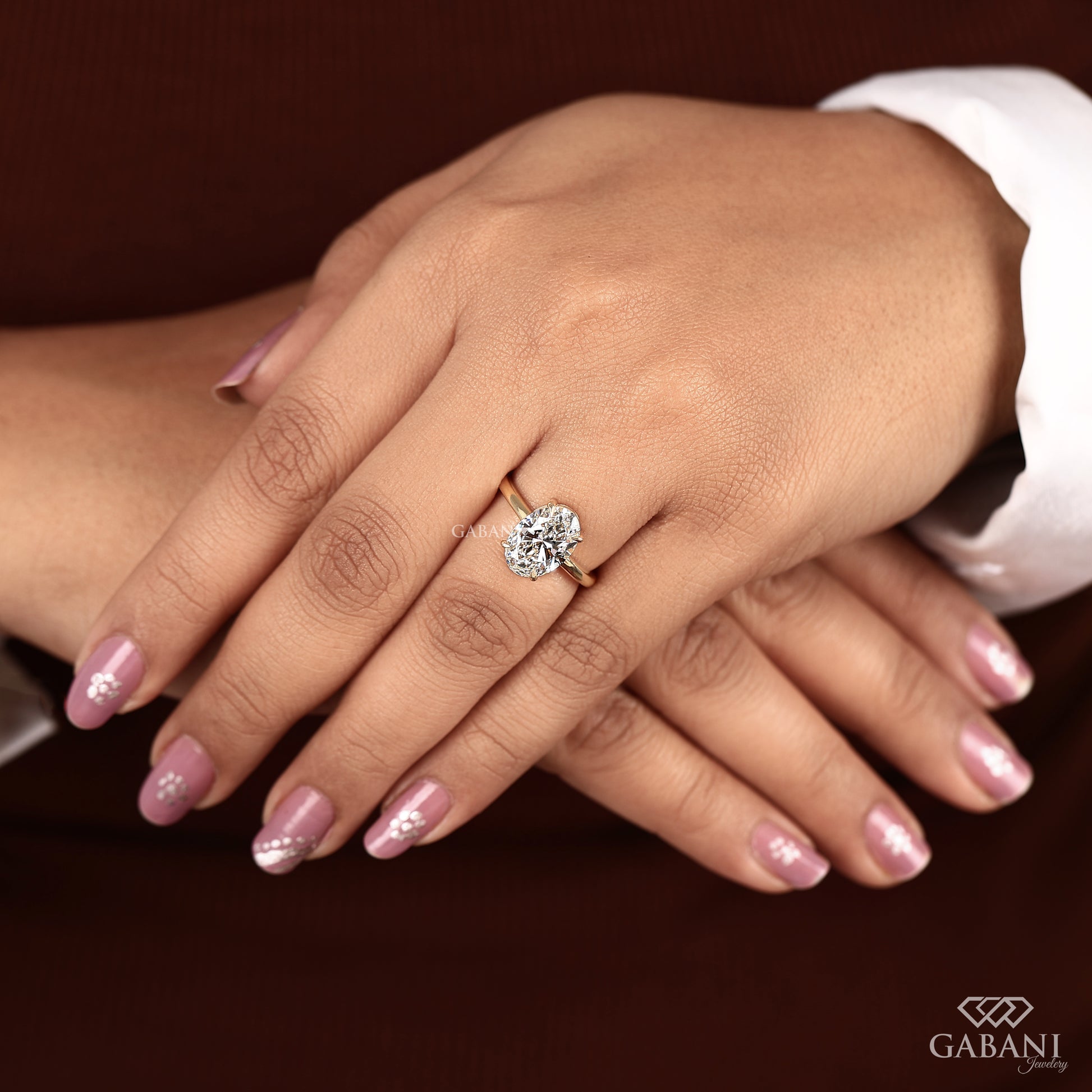 yellow gold solitaire ring with VS1 clarity oval diamond
