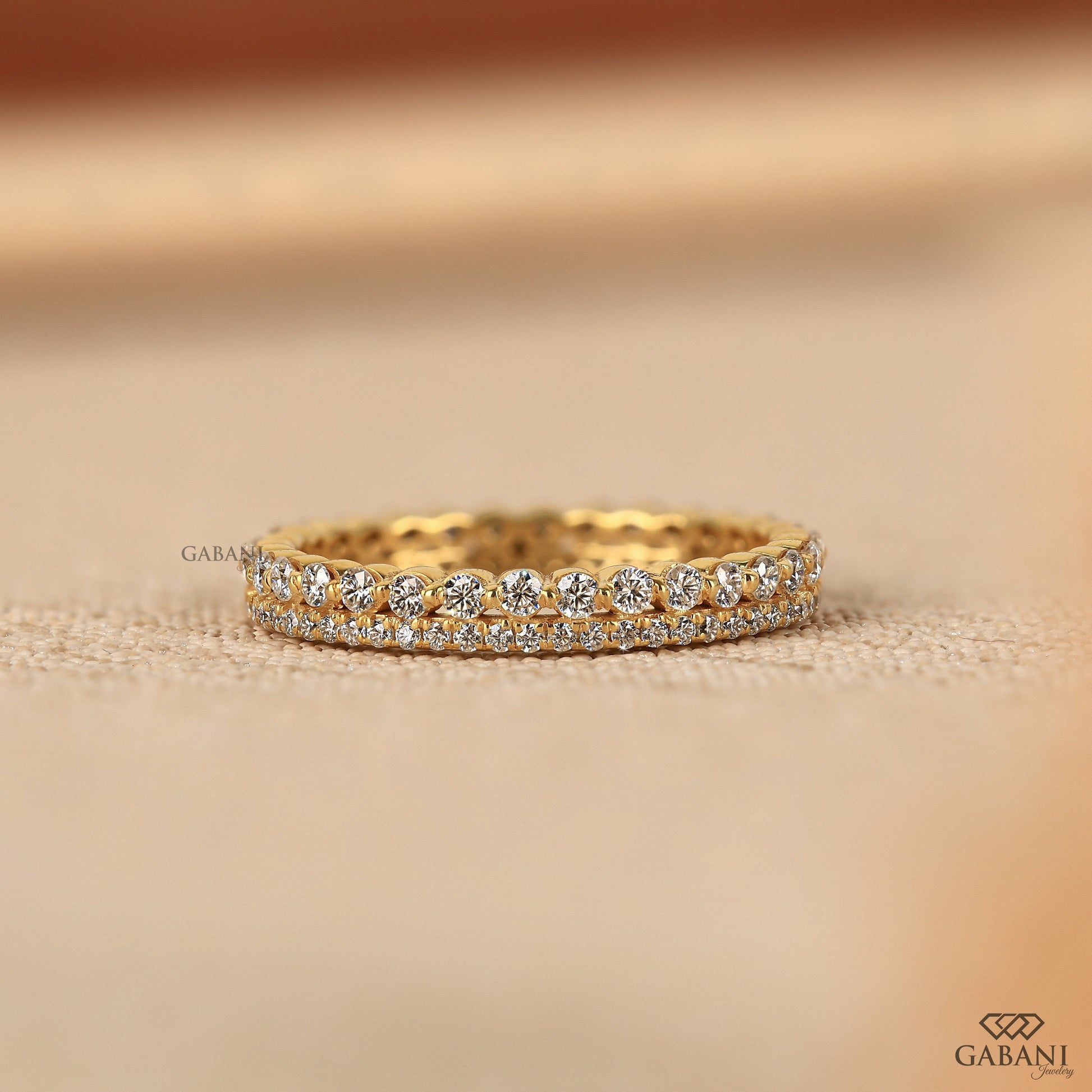 double row lab grown diamond band in yellow gold with thin minimal design and pave prong setting for stacking or daily wear