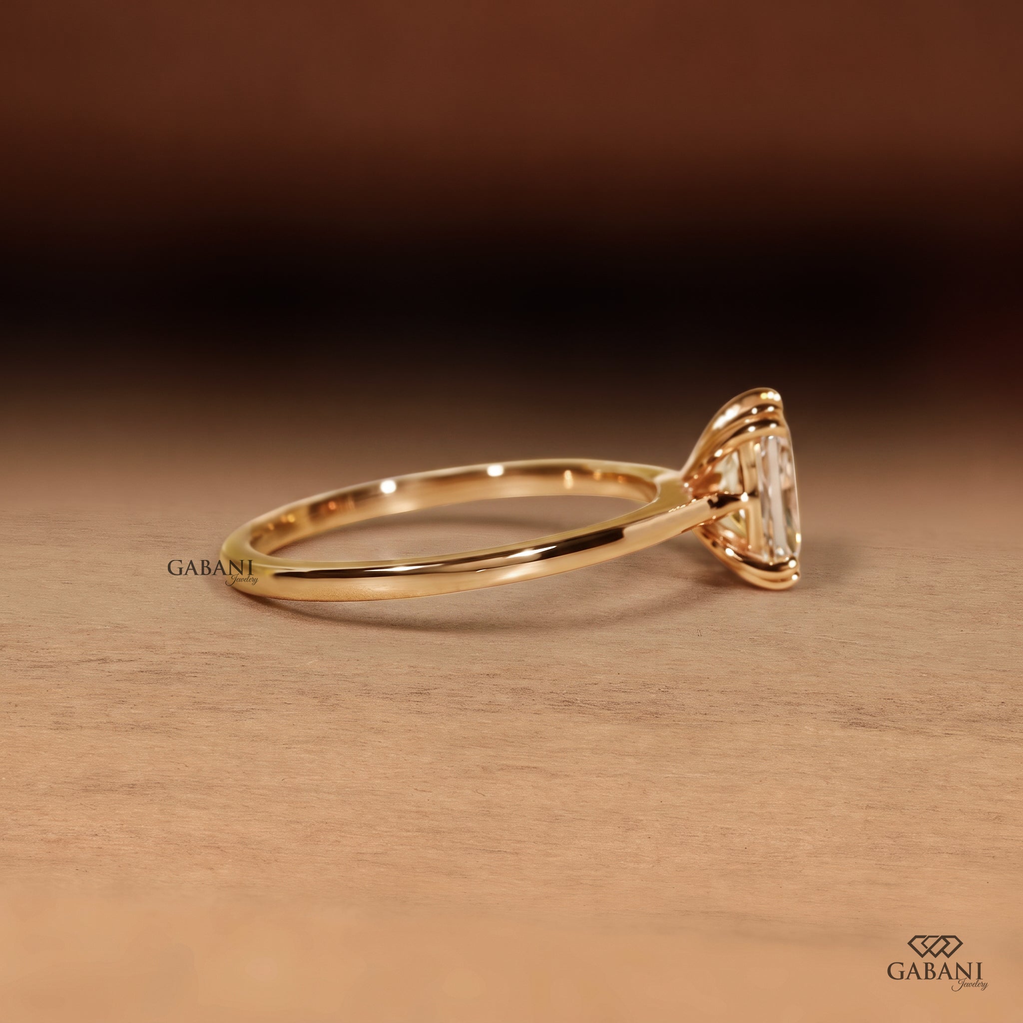 Radiant cut lab grown diamond engagement ring in 18K yellow gold with double claw prongs, elongated center stone and a slim polished solitaire band.