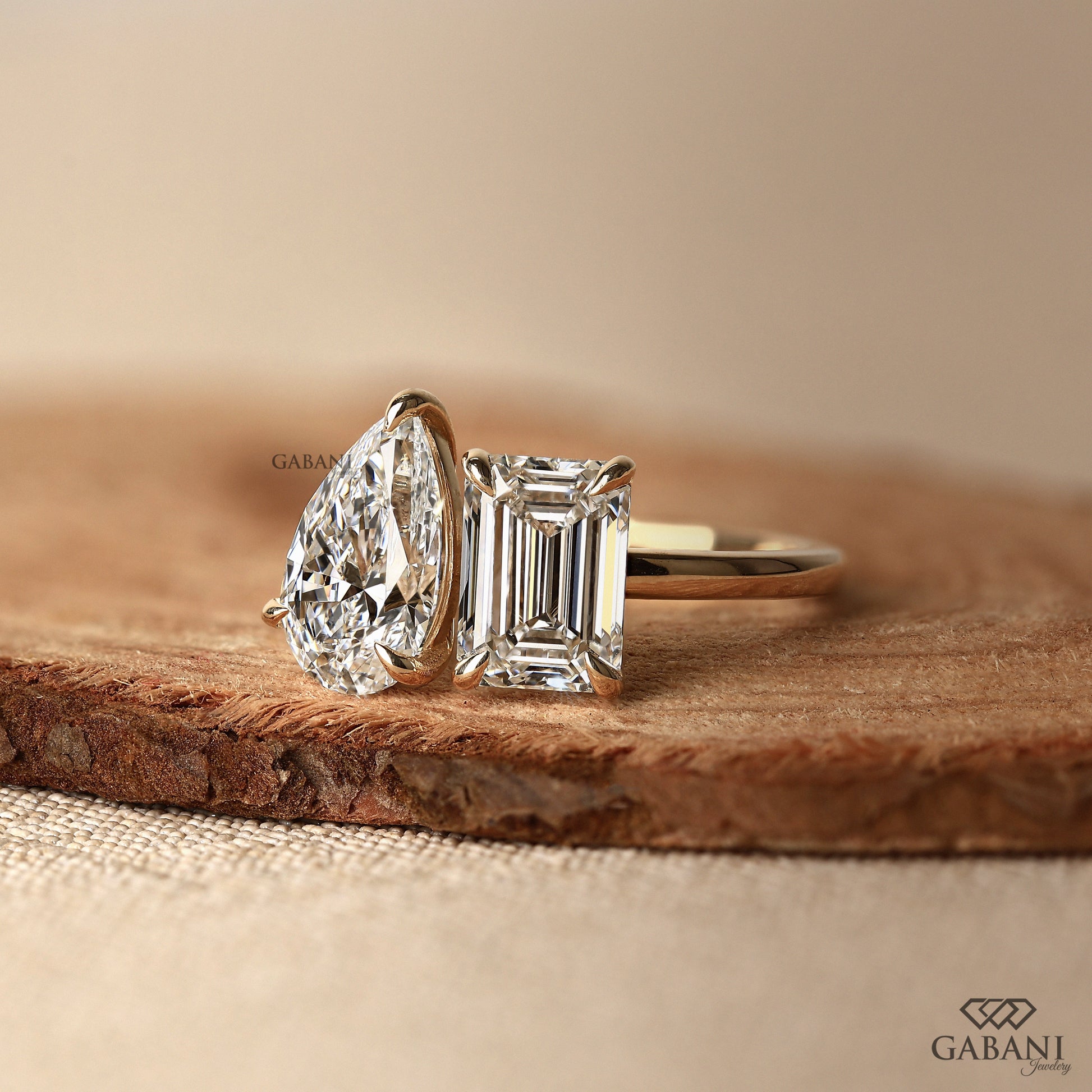 Gabani Jewelry two diamond you and me ring with emerald and pear cut lab diamonds in gold