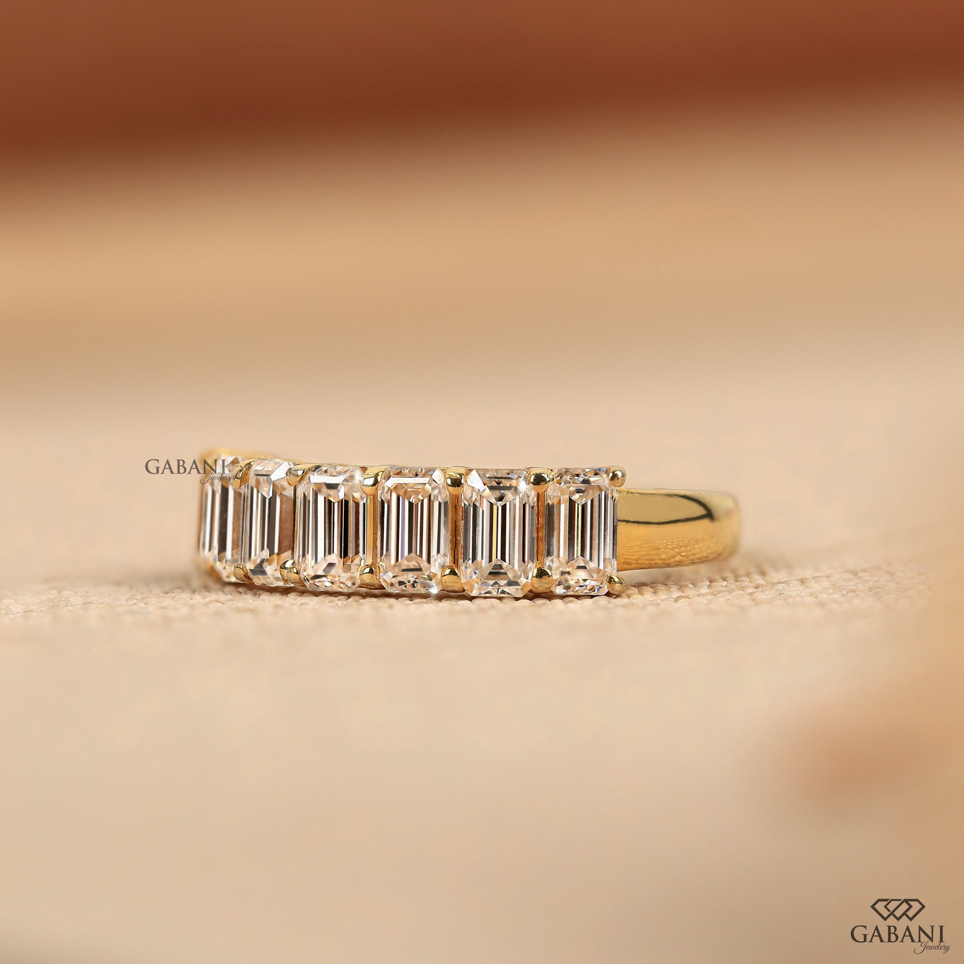 Lab grown emerald cut diamond wedding band in solid yellow gold