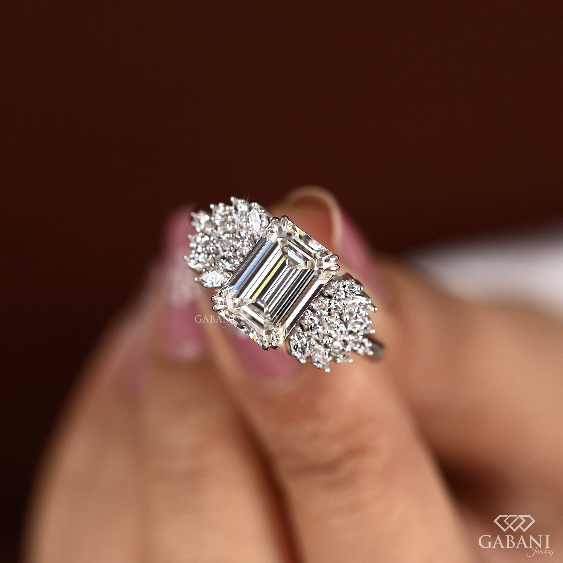 lab grown emerald cut diamond ring with marquise clusters and solid white gold shank
