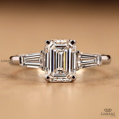 Emerald cut lab grown diamond three stone engagement ring by Gabani Jewelry