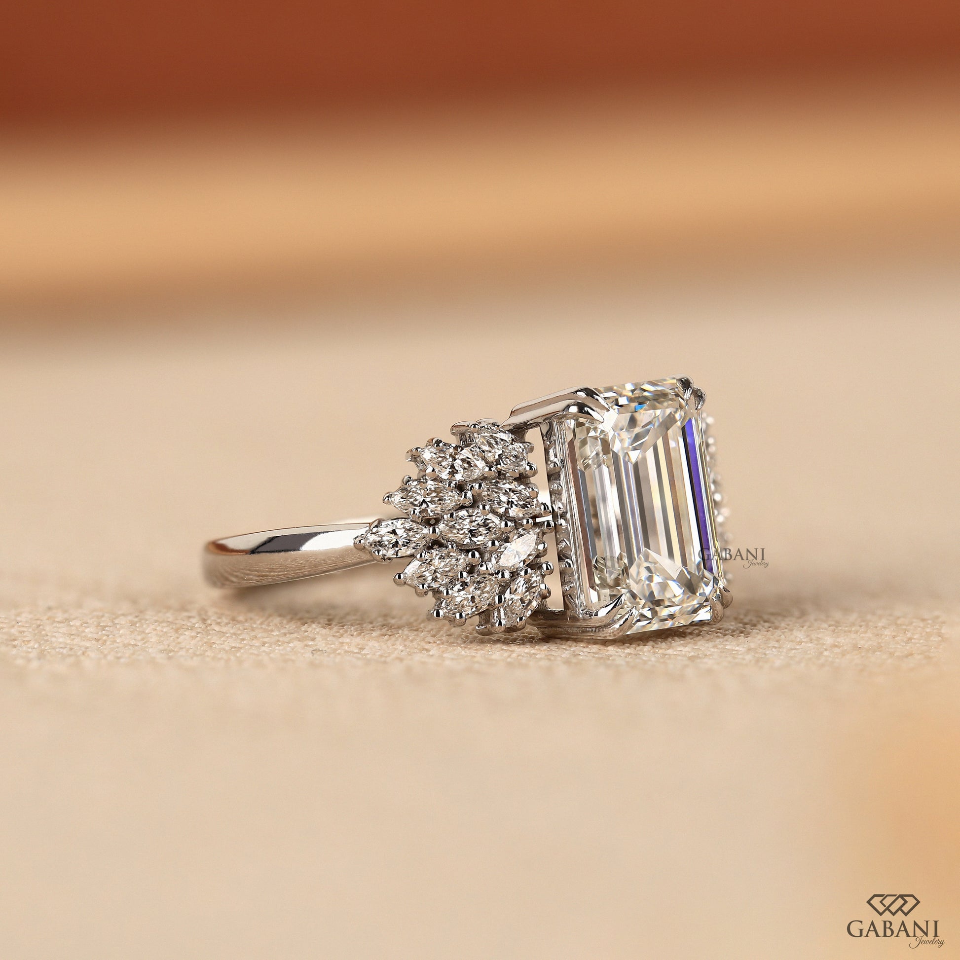 emerald cut lab grown diamond ring in white gold with elevated center setting