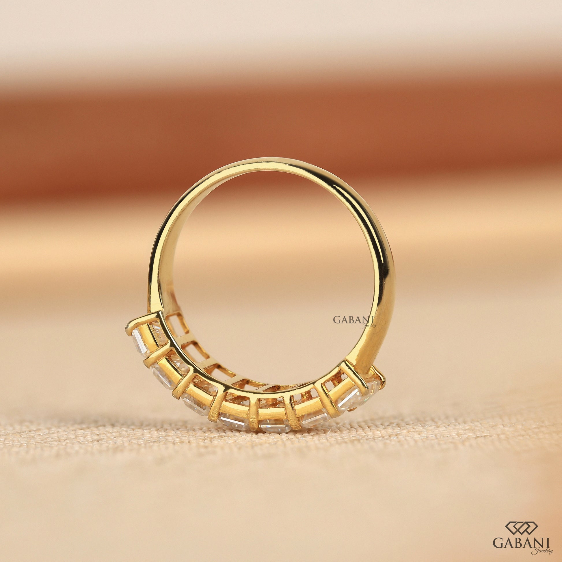 Chunky emerald cut lab grown diamond band in yellow gold