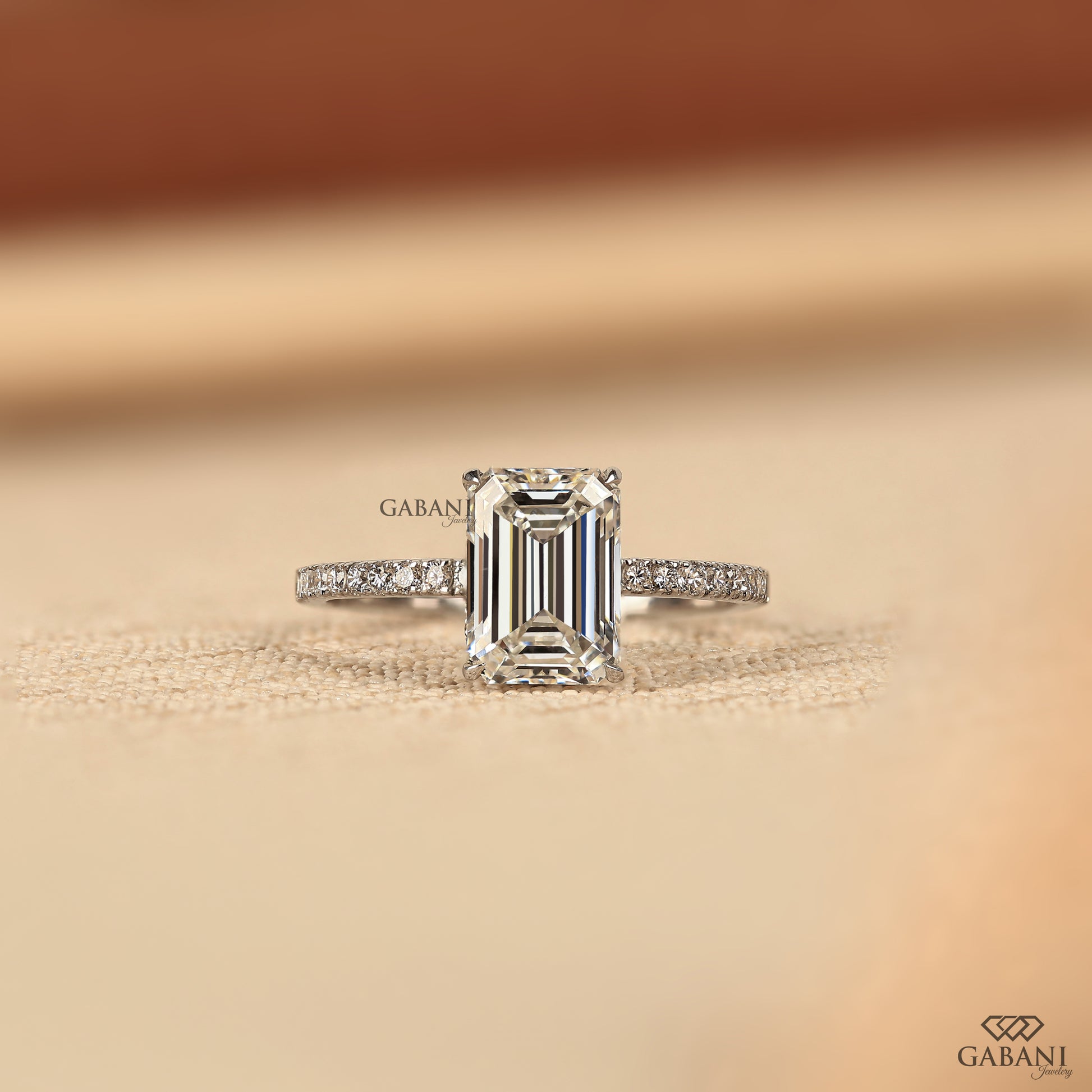 emerald cut lab created diamond solitaire ring in white gold with prong setting and hidden halo design