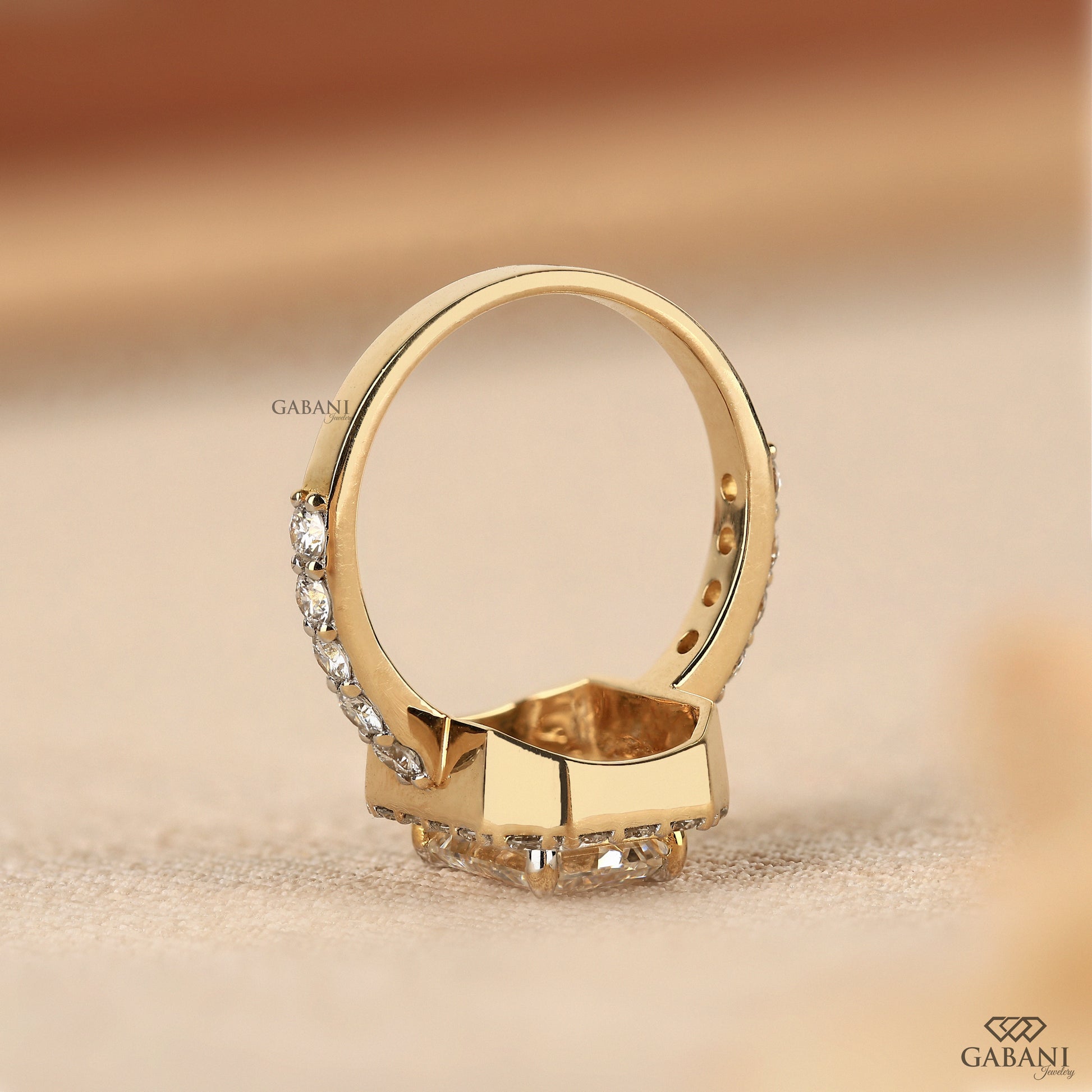 classic halo ring with emerald cut lab grown diamond in solid yellow gold