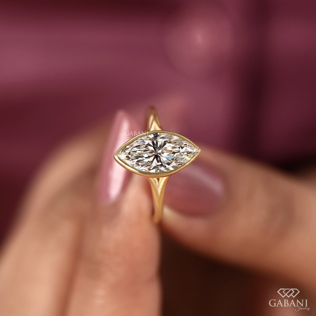 engagement ring with full bezel setting in yellow gold