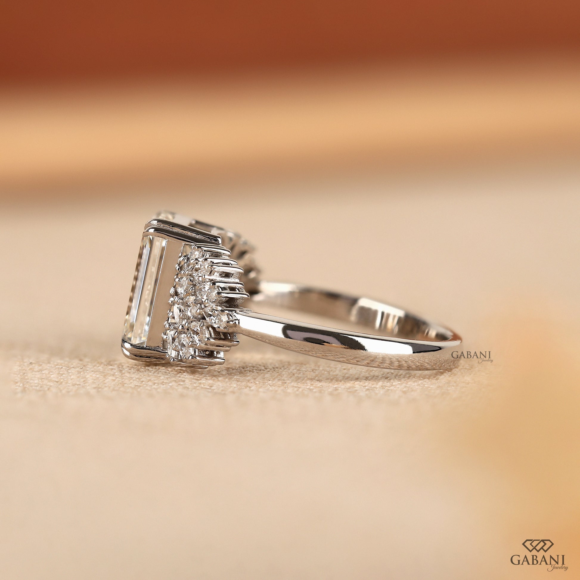 architectural emerald cut lab diamond ring with marquise side stones in white gold
