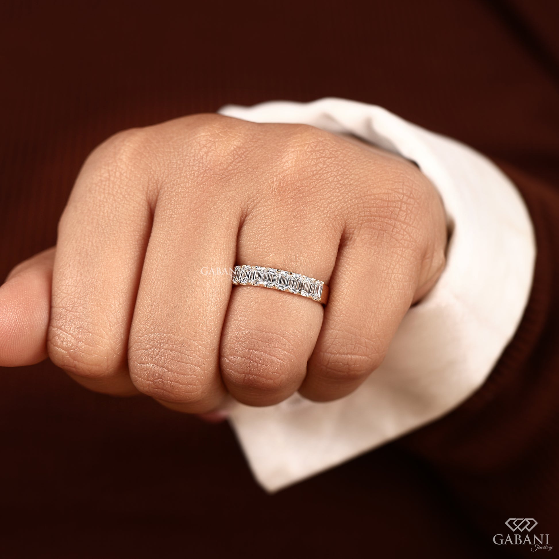 yellow gold half eternity band with emerald cut lab diamonds in u prong setting for daily wear
