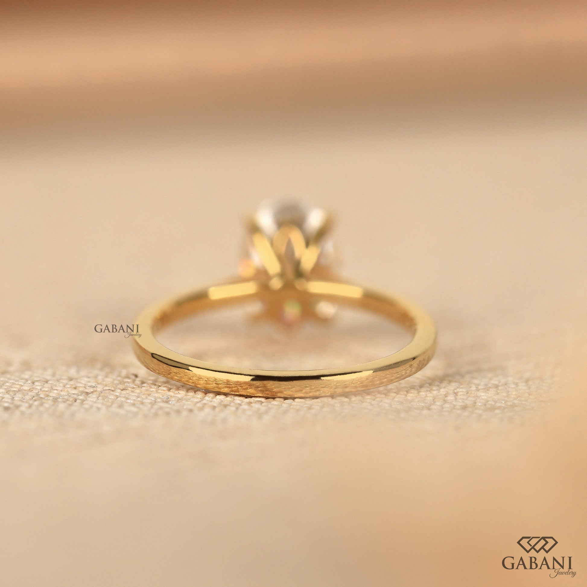 oval cut lab grown diamond ring with simple solitaire style and smooth polished finish