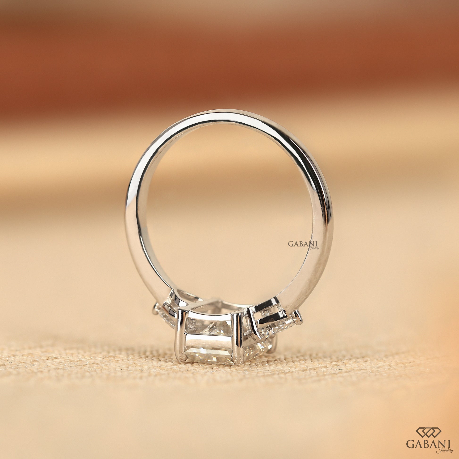 Radiant cut lab grown diamond engagement ring with heart side stones in solid white gold